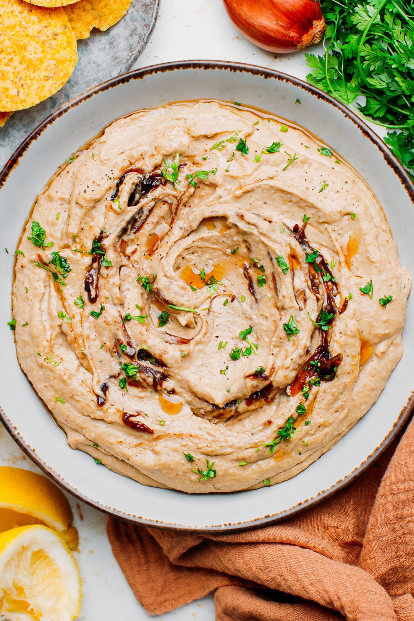 Caramelized shallots hummus topped with cilantro and toasted sesame oil.