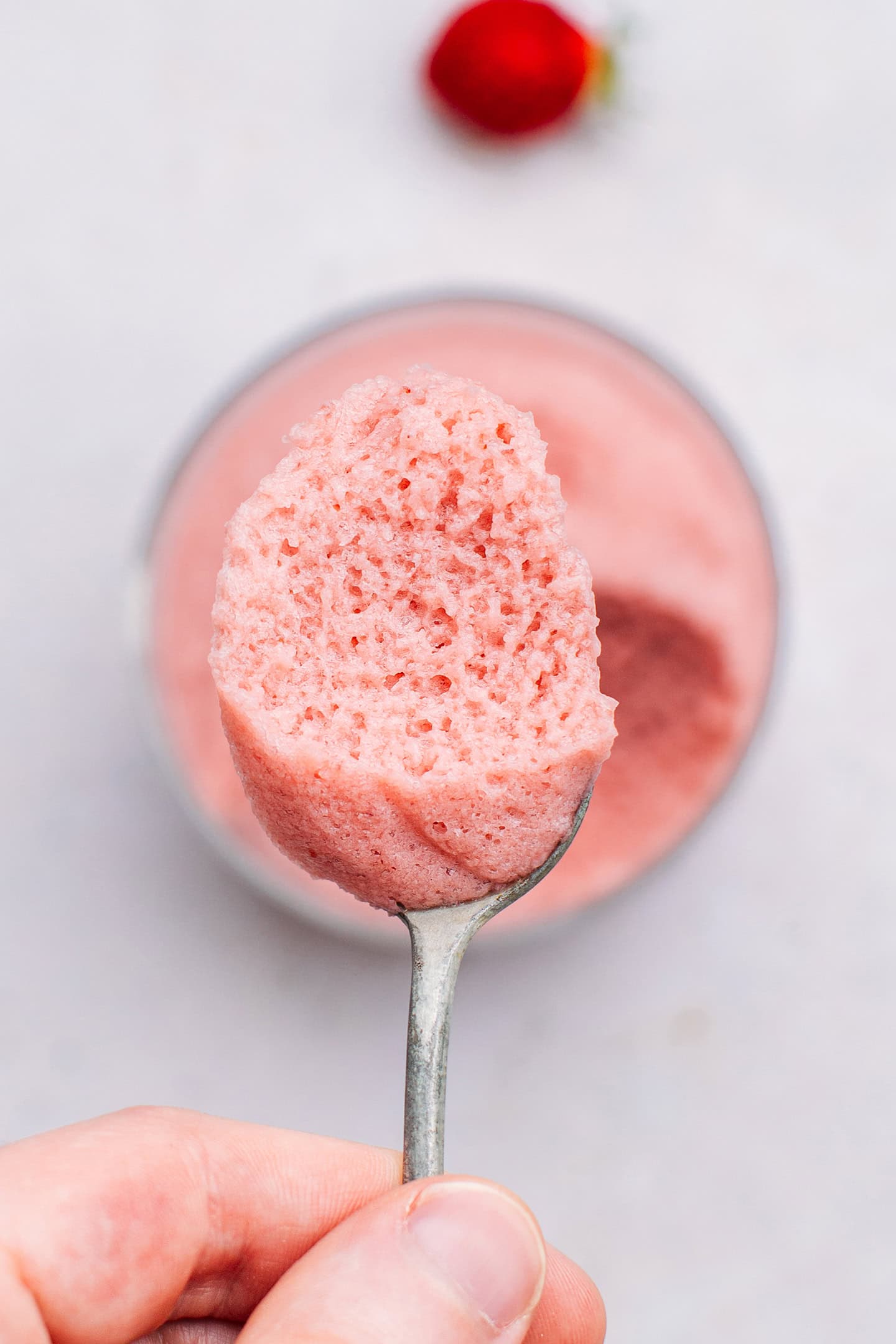 Close-up of a spoonful of strawberry mousse.