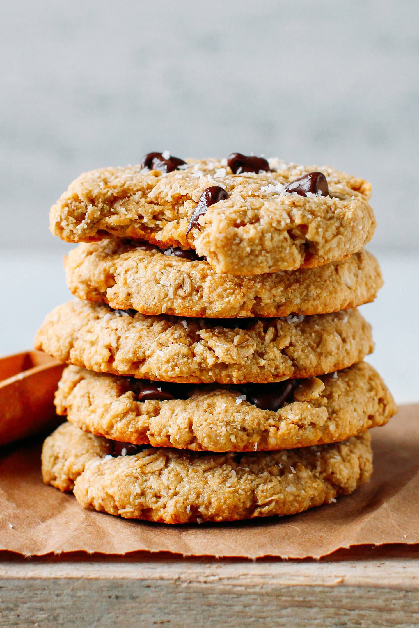 Stack of oat and coconut cookies with chocolate chips.