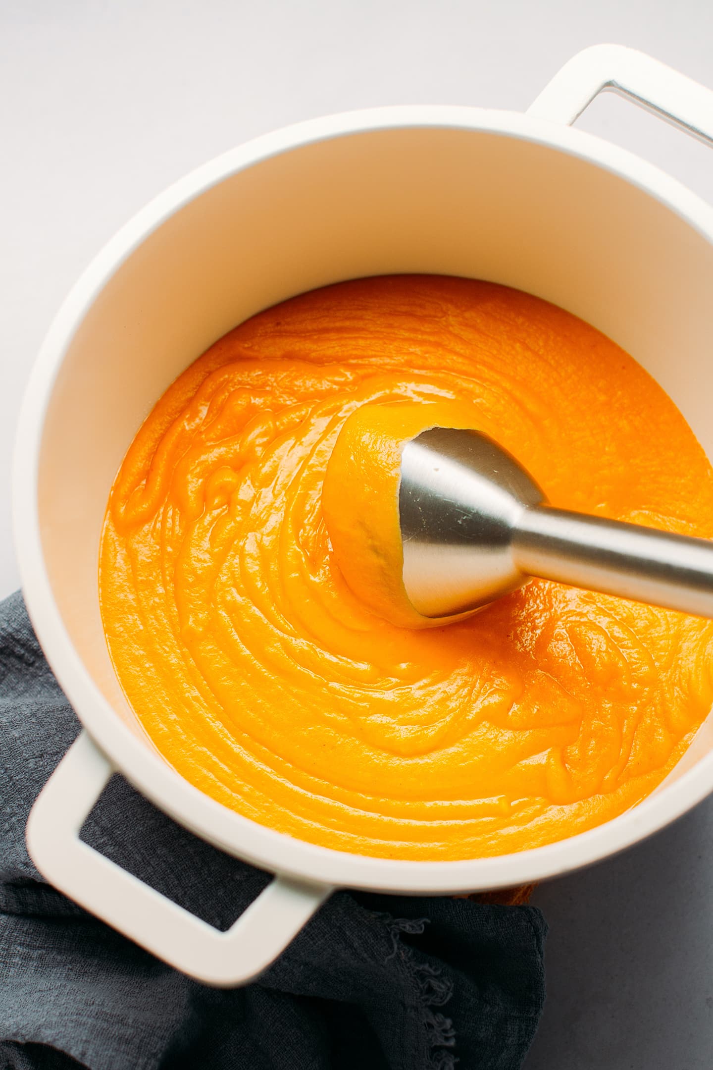 Blended sweet potato soup in a pot.