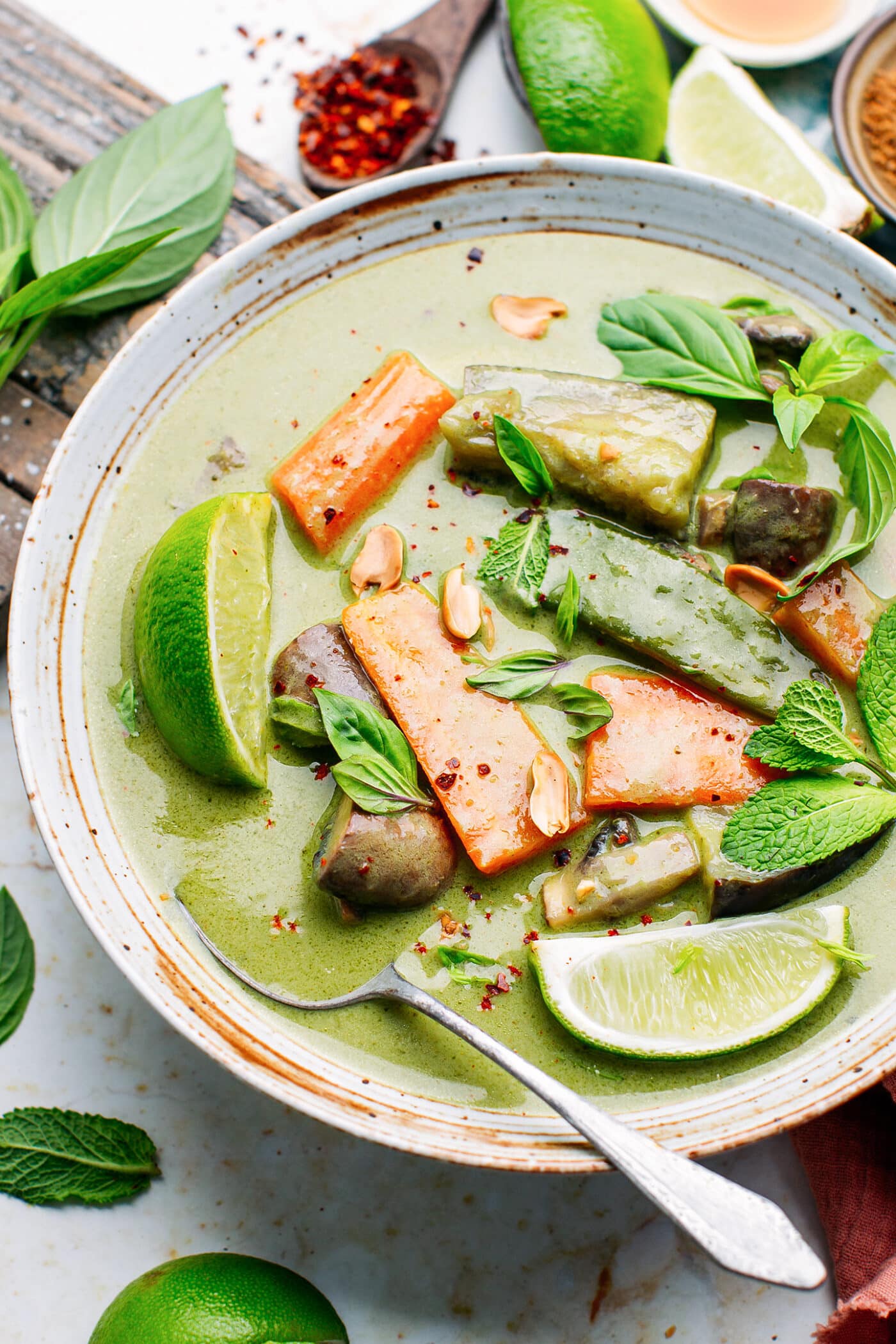 Close-up of green curry in a bowl.