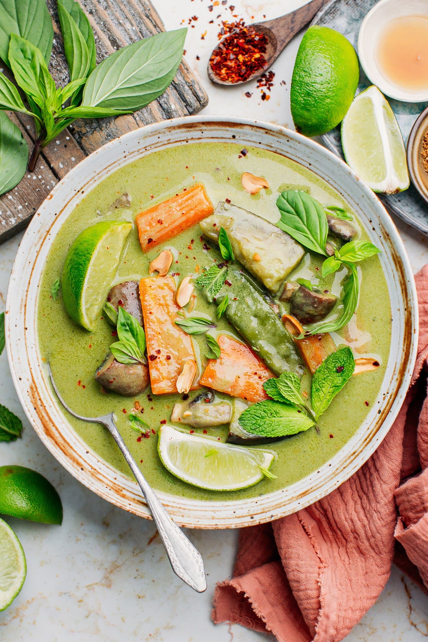 Vegan thai green curry with carrots, eggplants, and mushrooms.