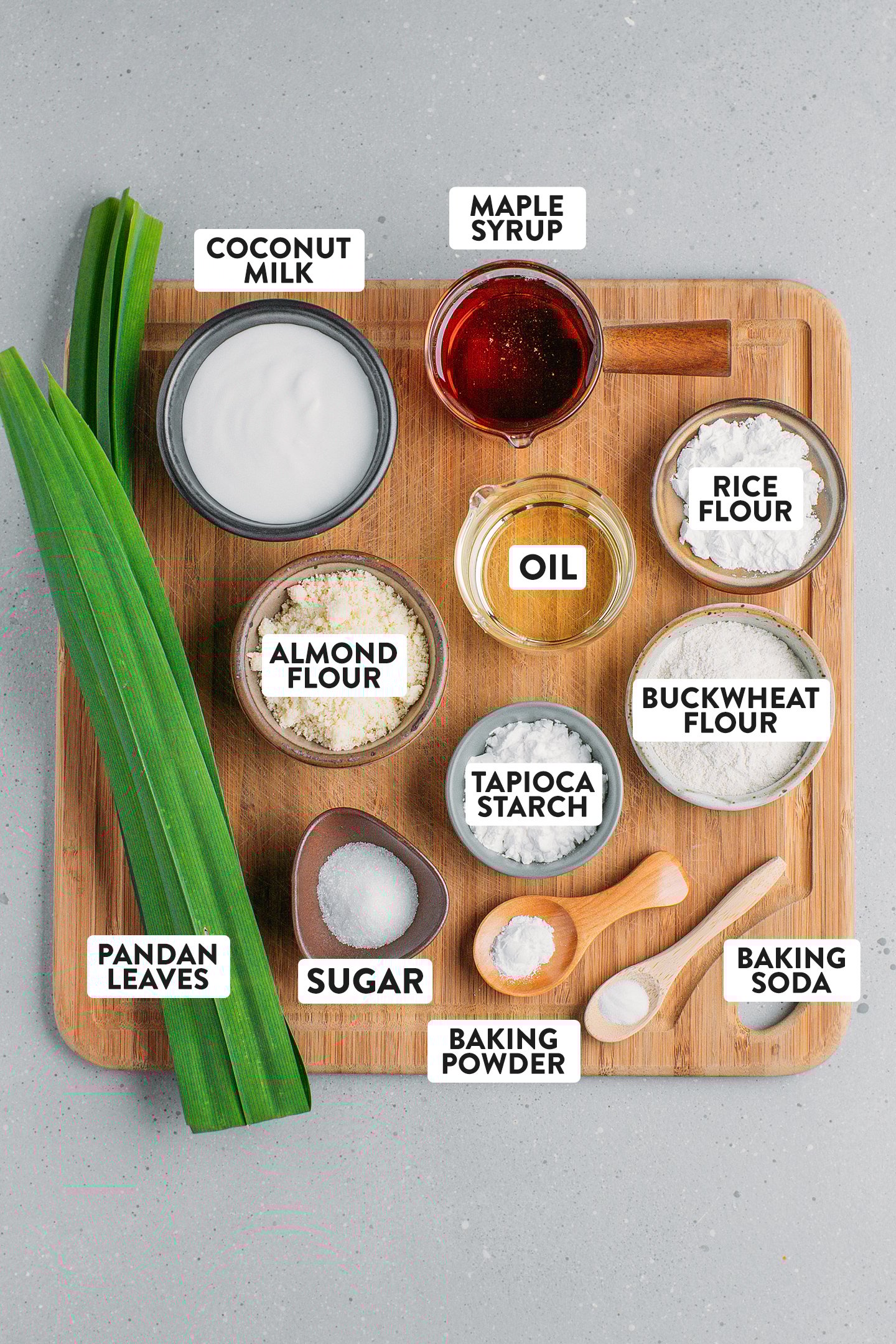 Ingredients like pandan leaves, coconut milk, almond flour, and maple syrup.