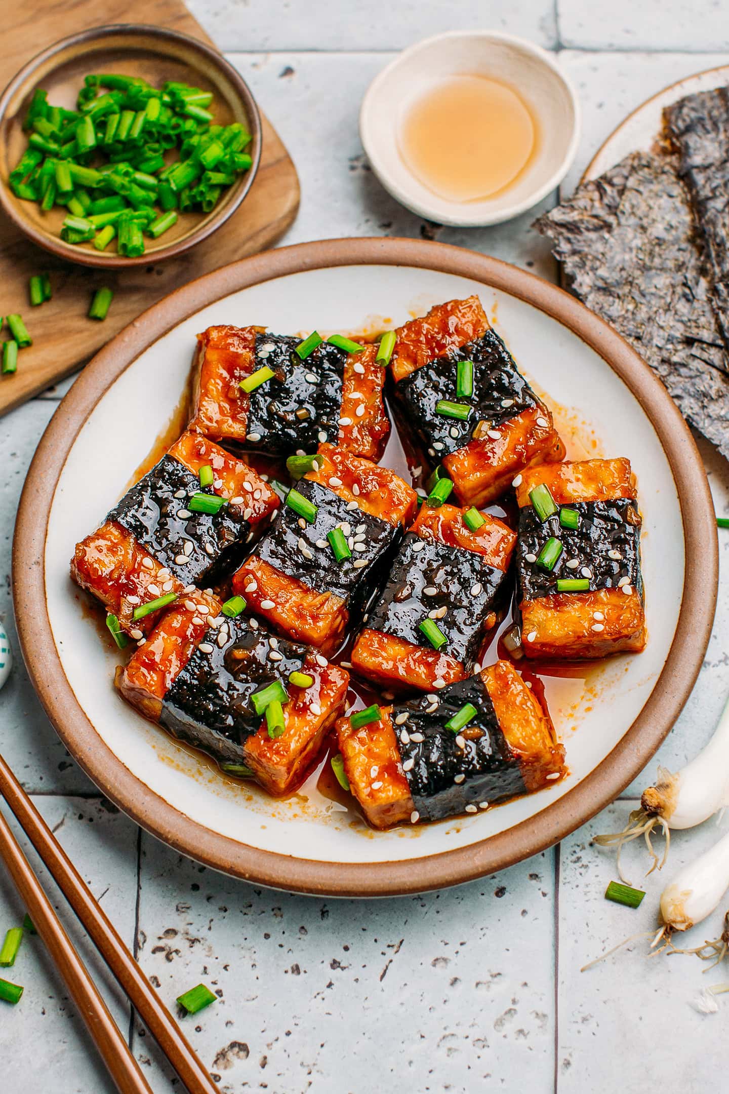 Tofu wrapped in seaweed and topped with green onions and toasted sesame seeds.