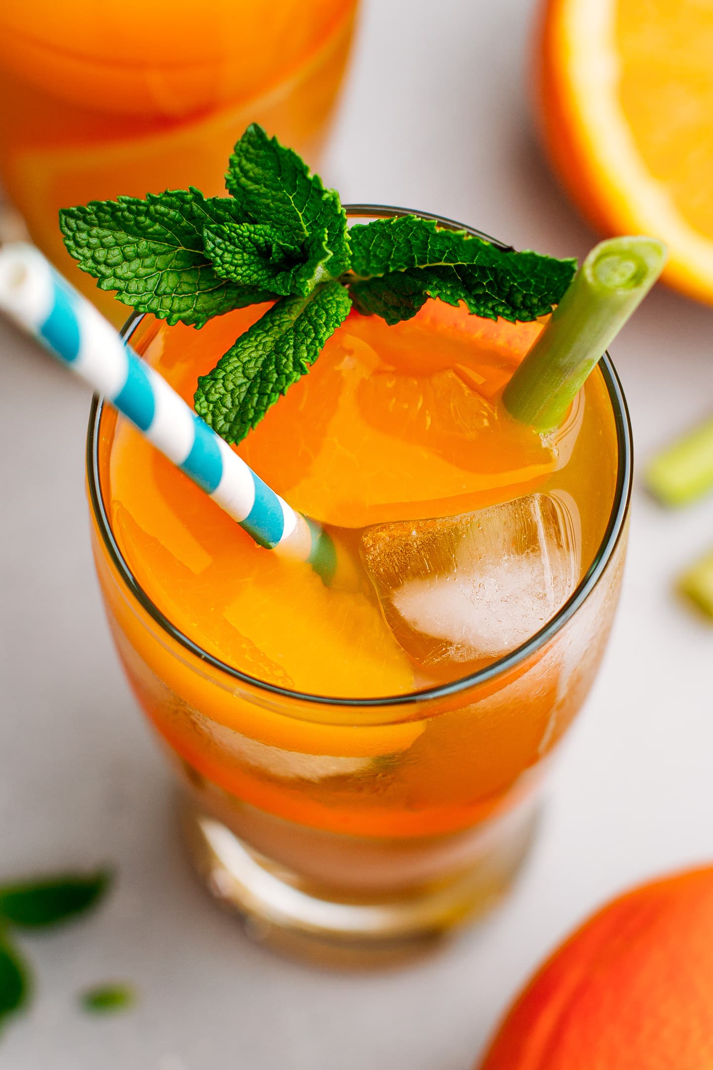 Close-up of peach, orange, and lemongrass iced tea.