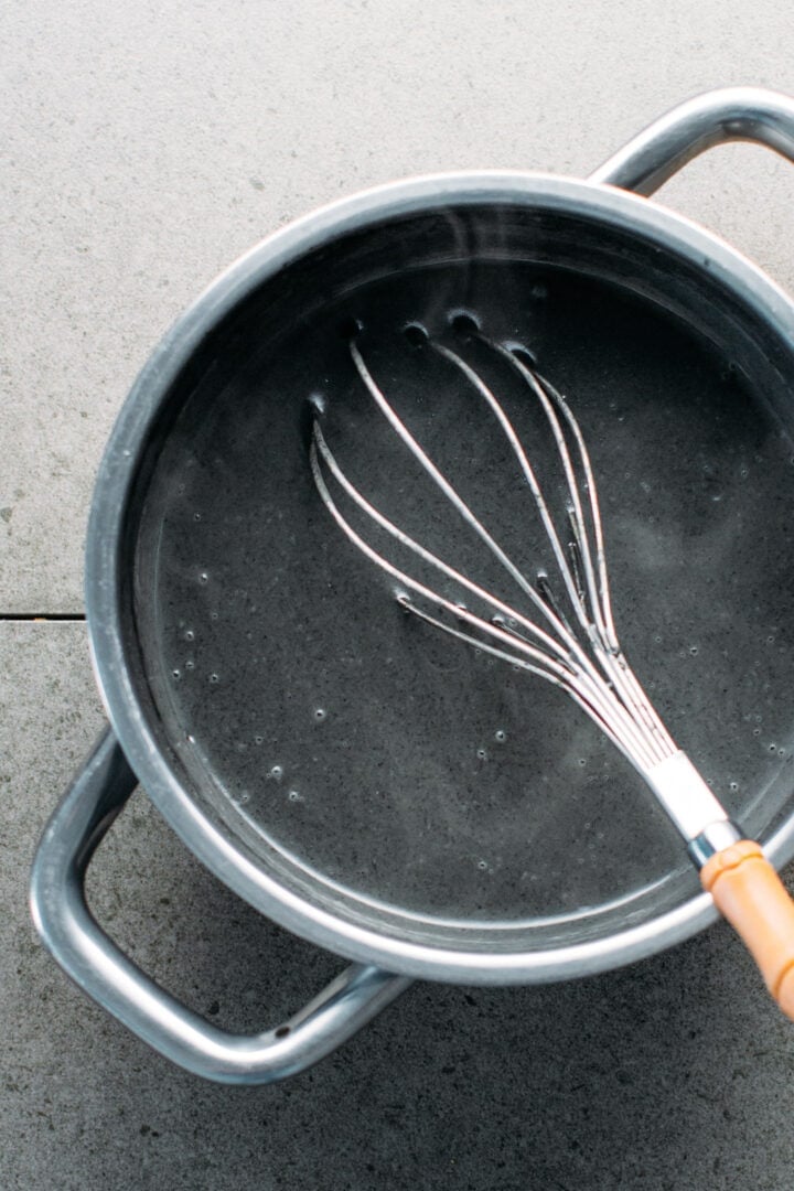 Black sesame soup in a saucepan.