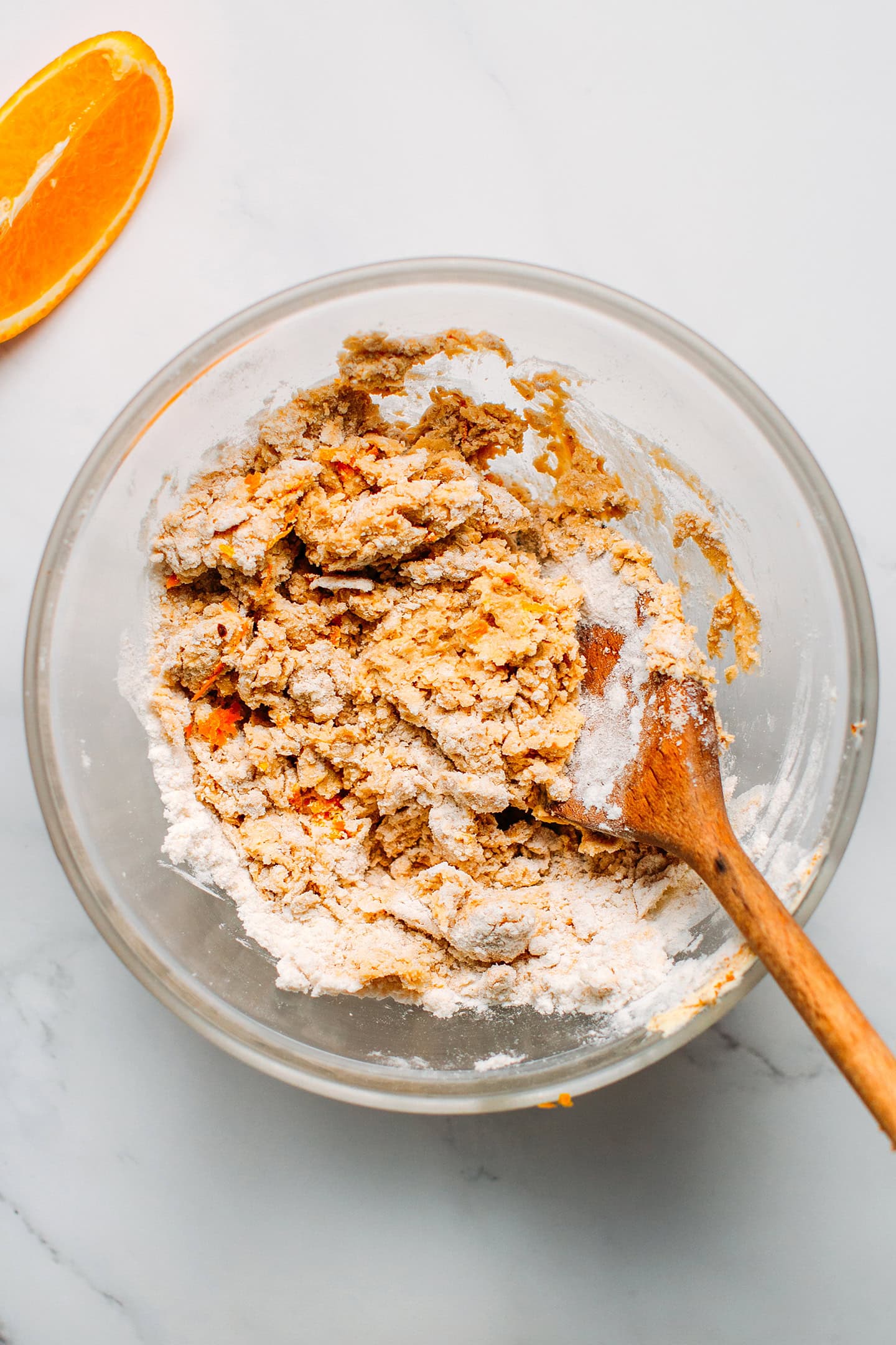 Gluten-free flour, orange zest, and sugar in a mixing bowl.