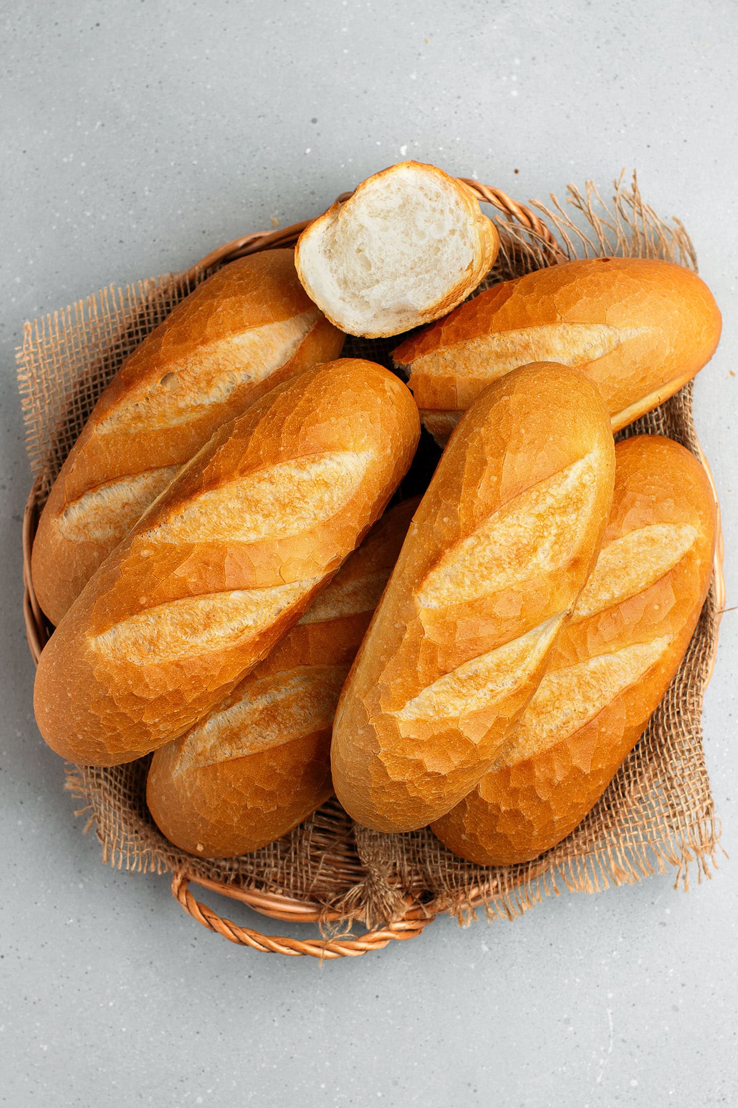 Banh mi bread on a rustic platter.