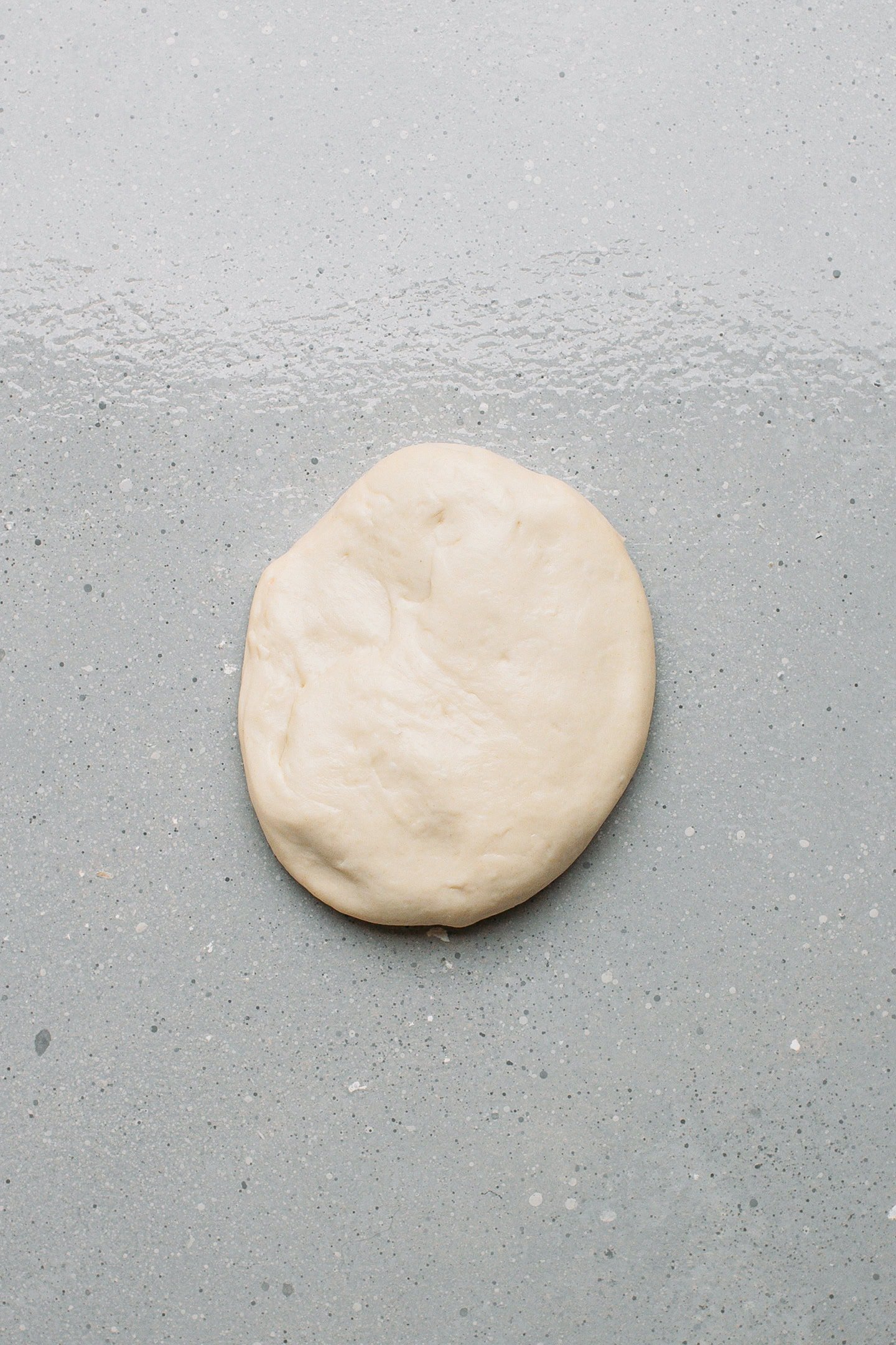 Flattened ball of dough.