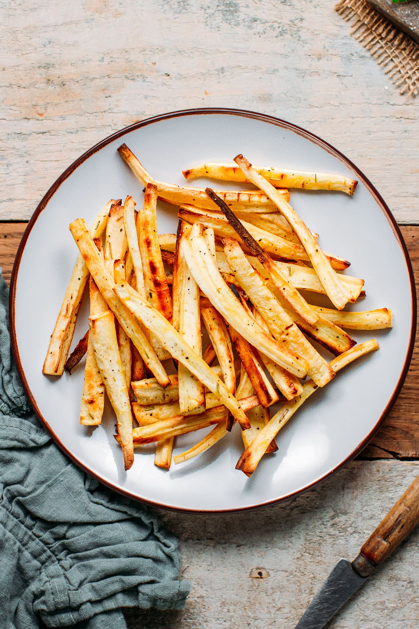 Baked Parsnip Fries with rosemary and ground black pepper.