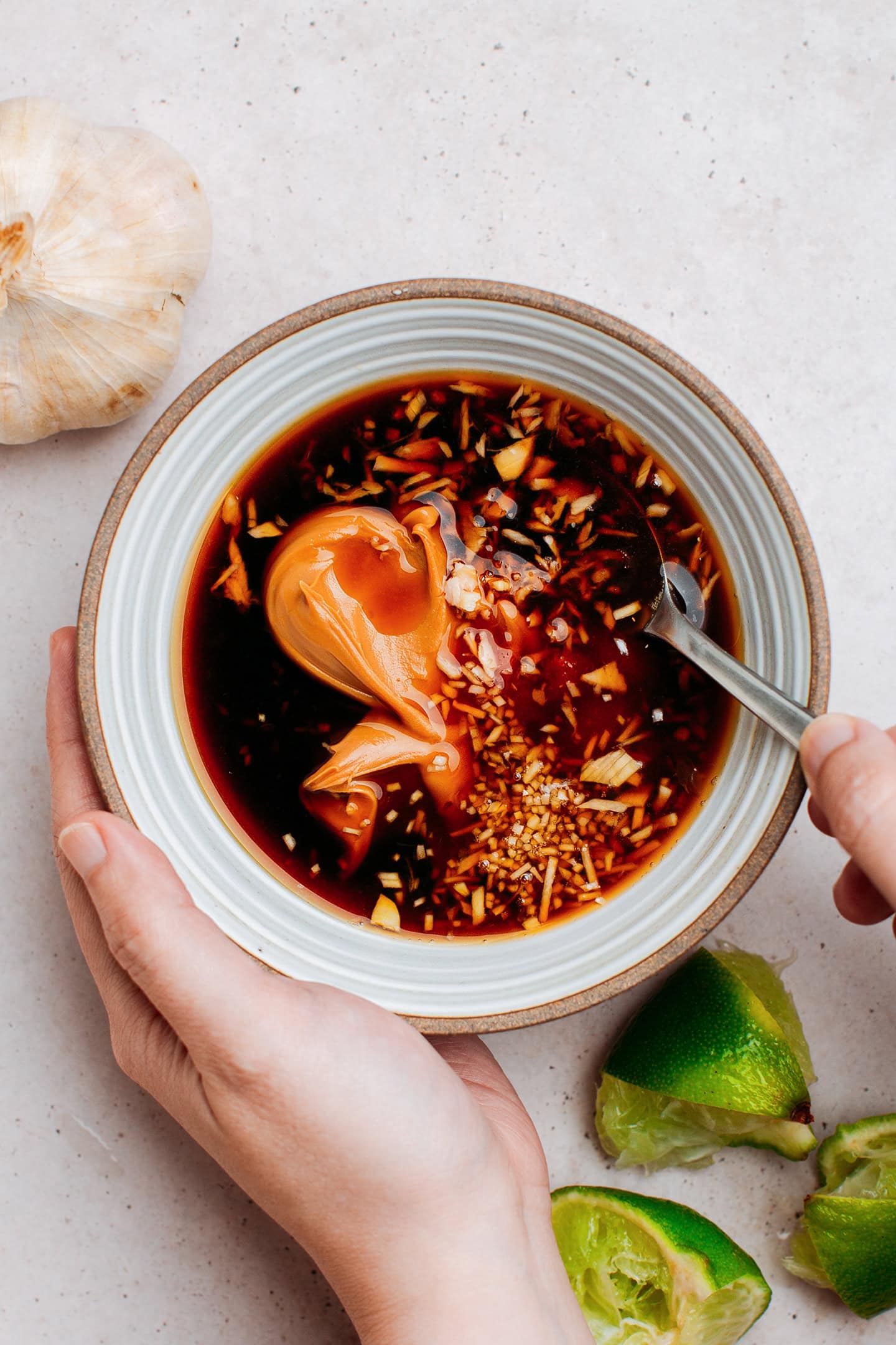 Peanut butter, garlic, ginger, and soy sauce in a small bowl.