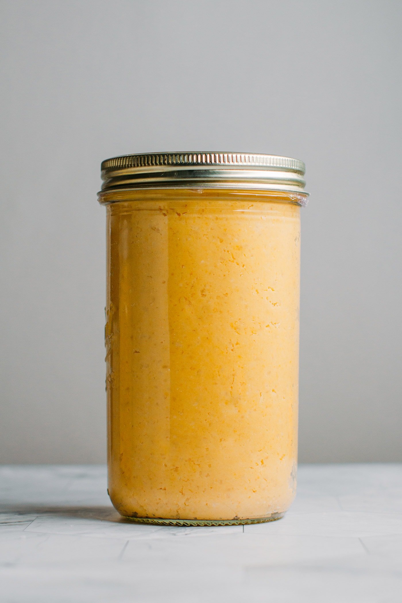 Chickpea miso fermenting in a jar.