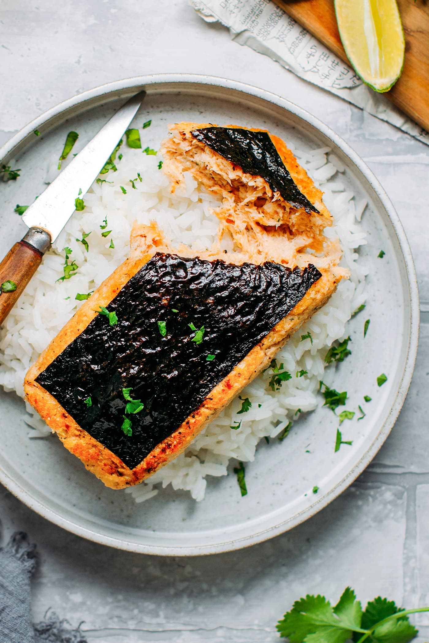 Vegan Fish Fillet on a bed of rice with cilantro.