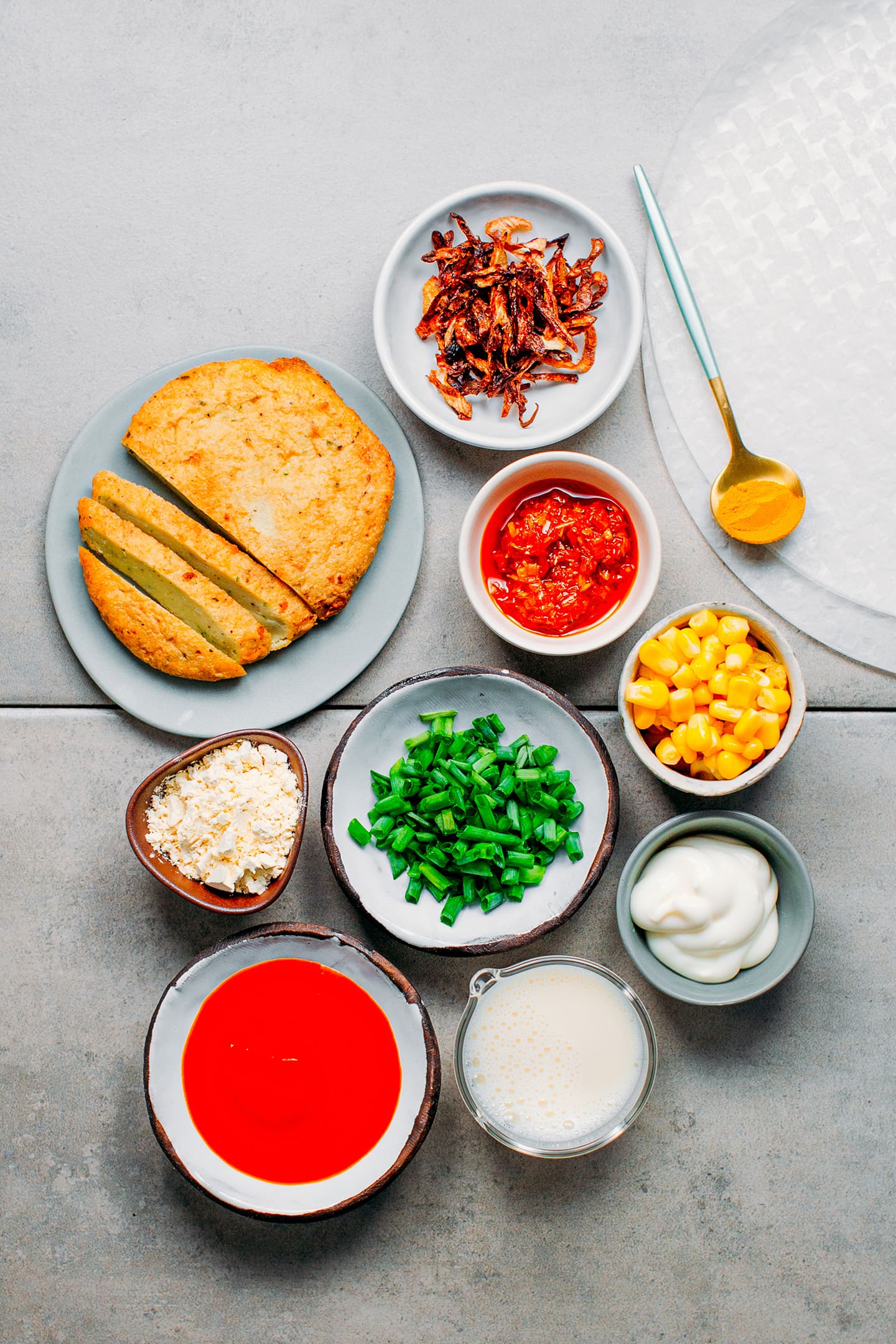 Ingredients like green onions, rice paper, corn, and chickpea flour.