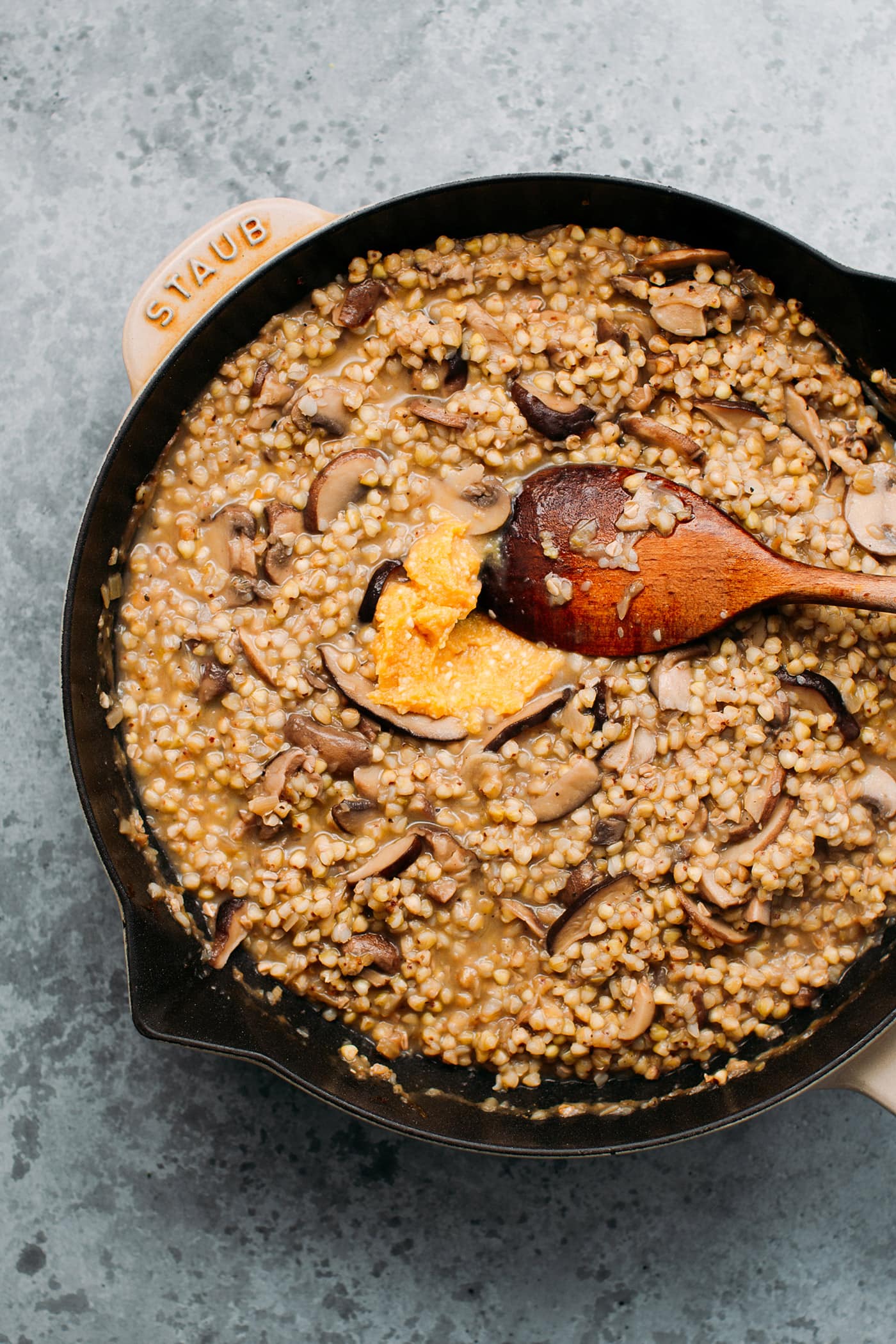 Buckwheat risotto in a skillet.