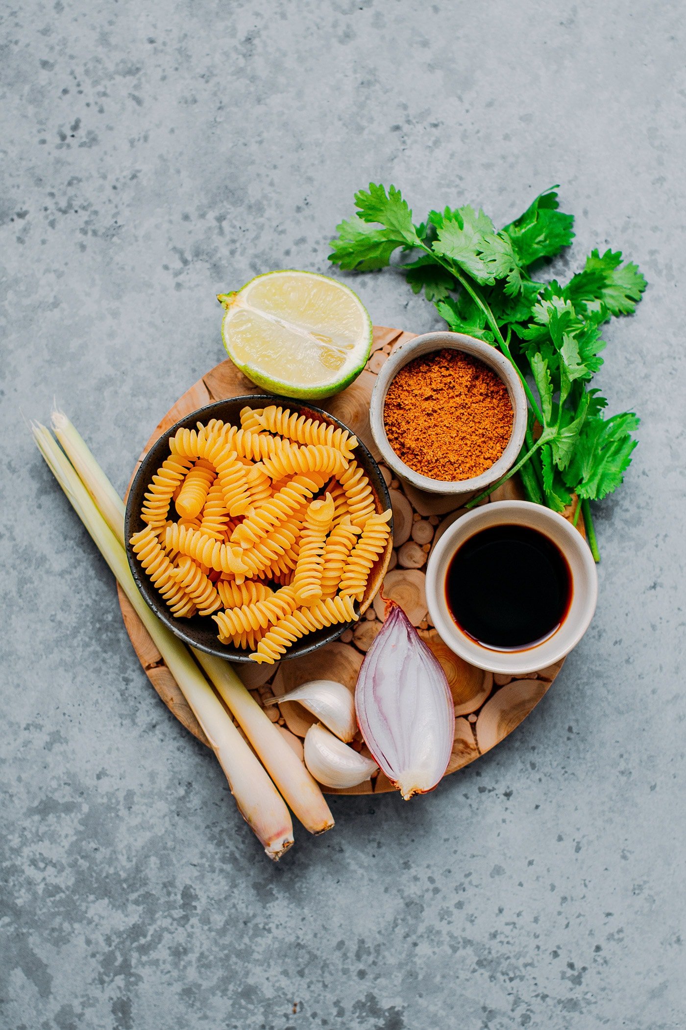 Pasta, cilantro, lime, shallots, garlic, and lemongrass to make a salad.