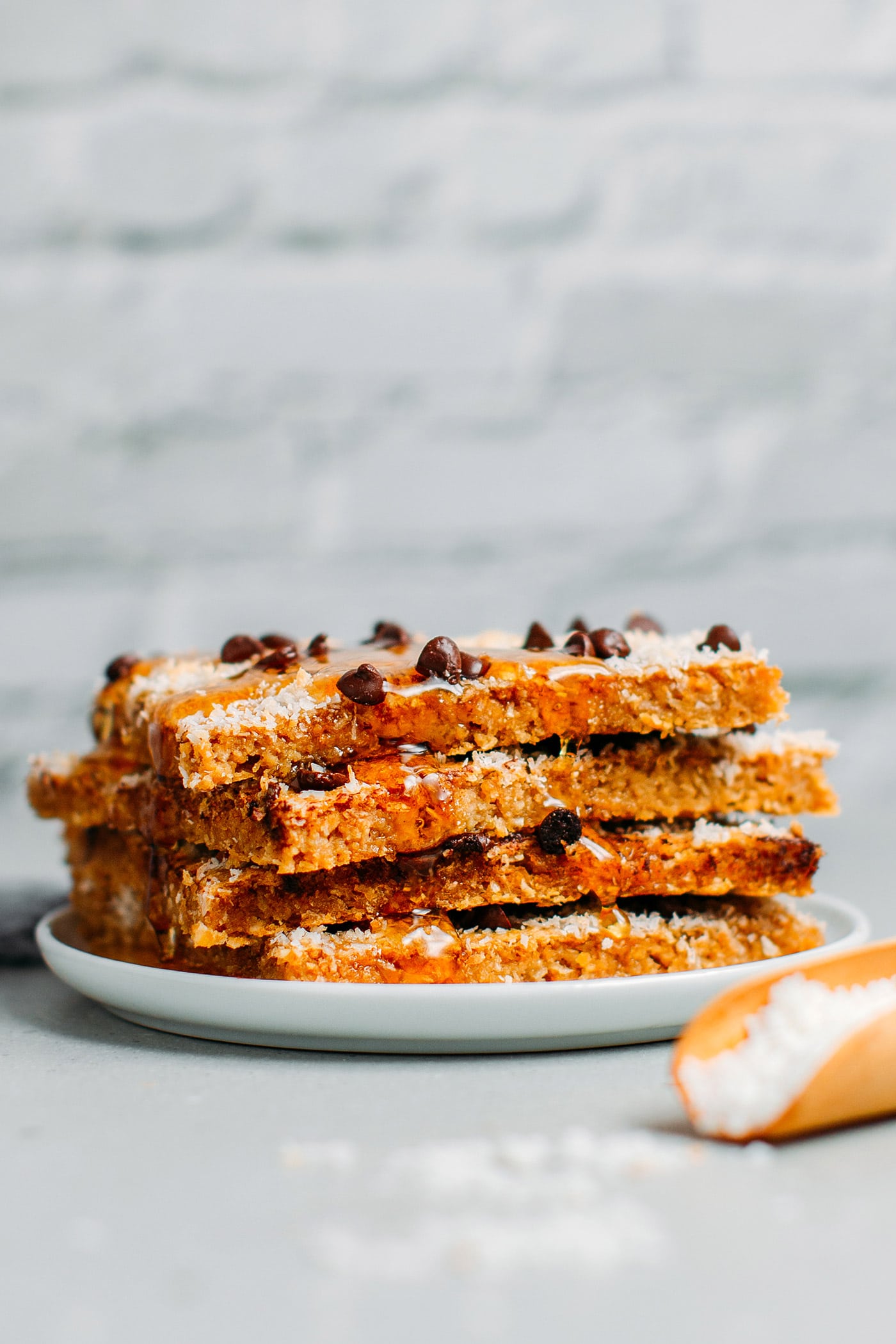 Sheet pan pancakes topped with coconut and chocolate chips.