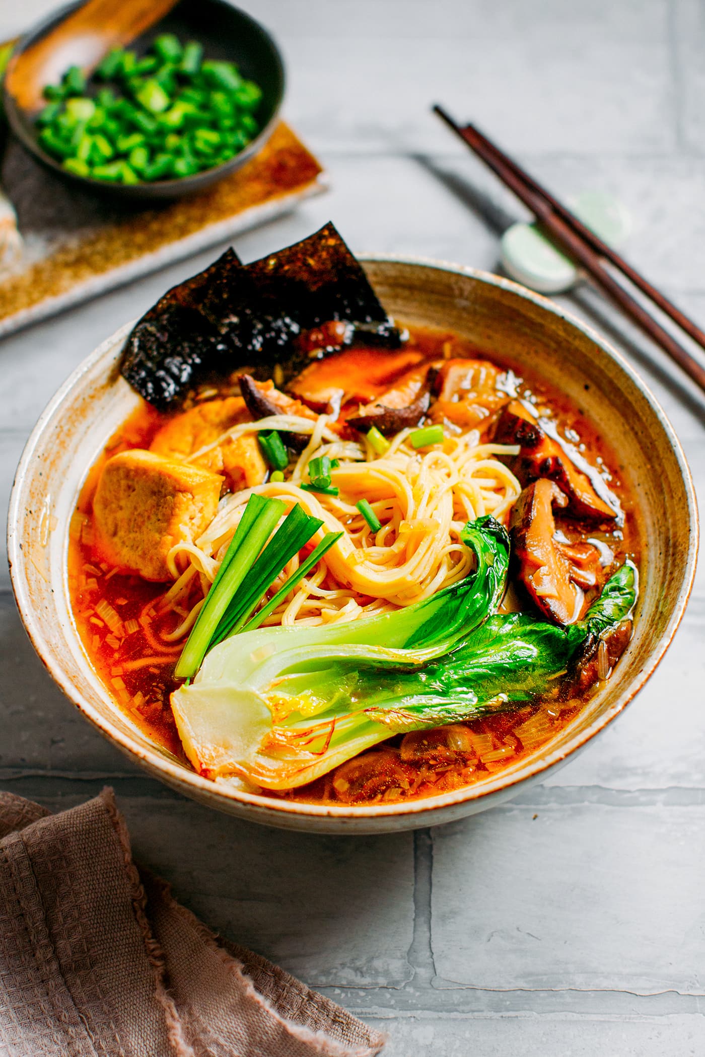 Vegan ramen with noodles, mushrooms, and pak choi