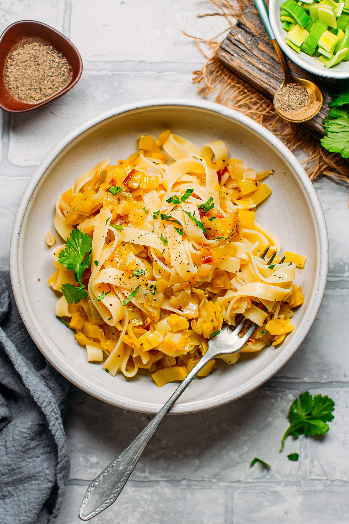 Pasta with melted leeks in a bowl.