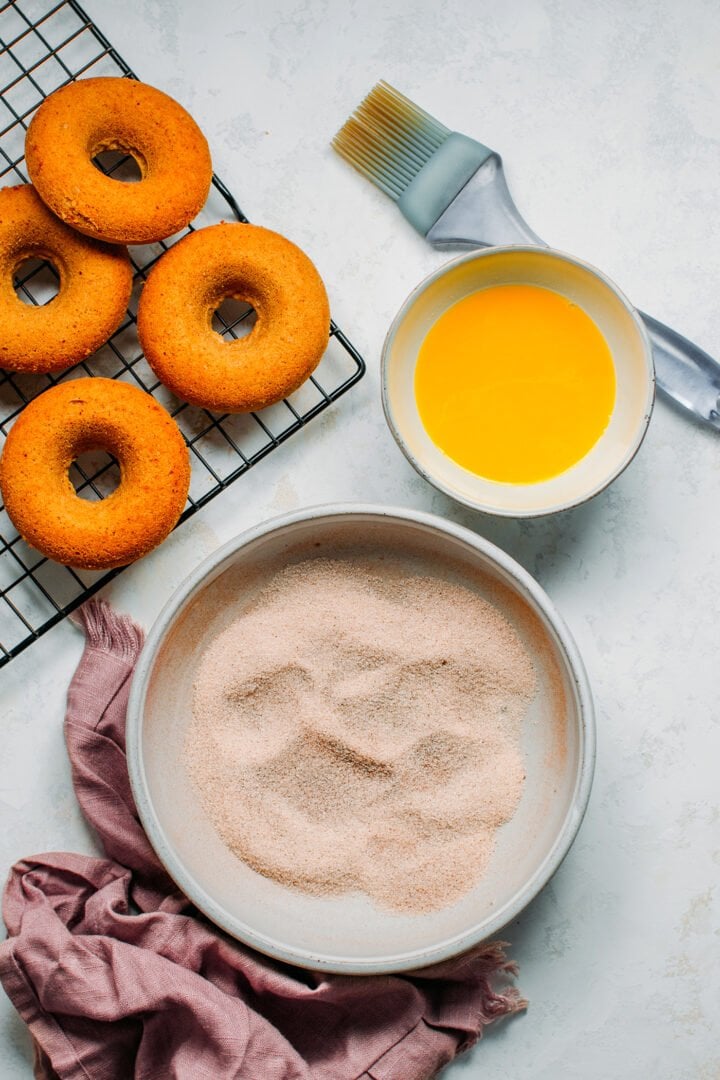 Vegan donuts, melted butter, and cinnamon sugar