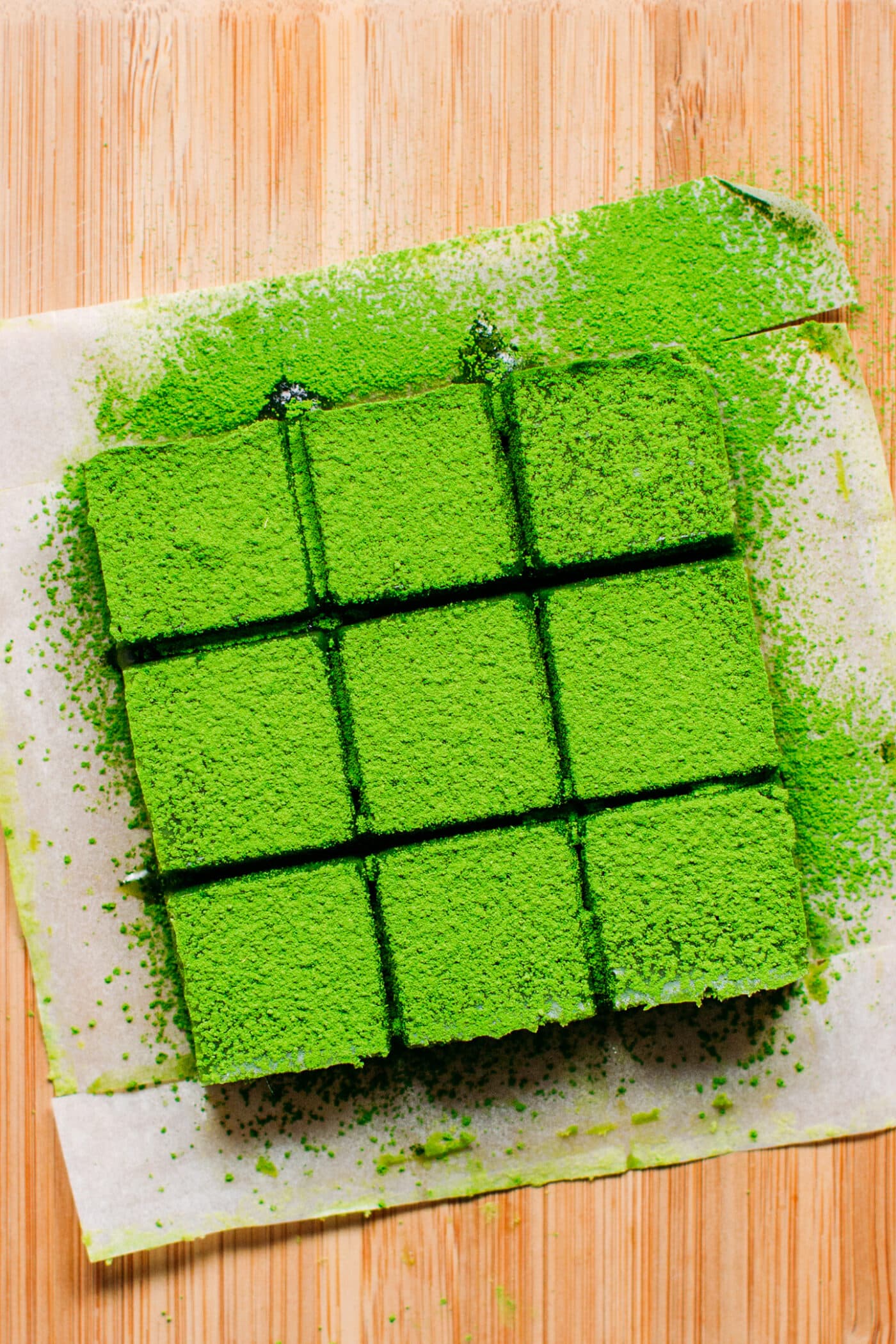 Cutting matcha white chocolate ganache into squares.