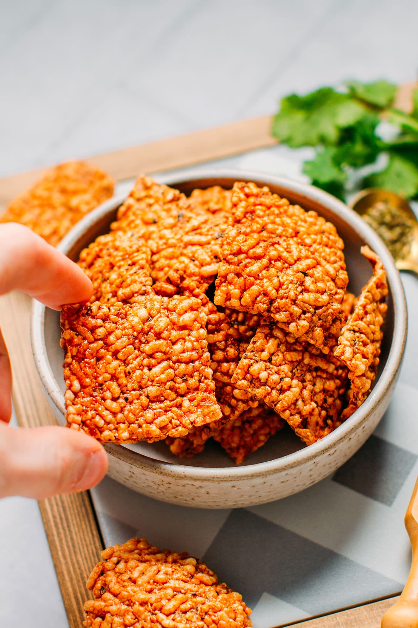 Pizza puffed rice crackers in a bowl.