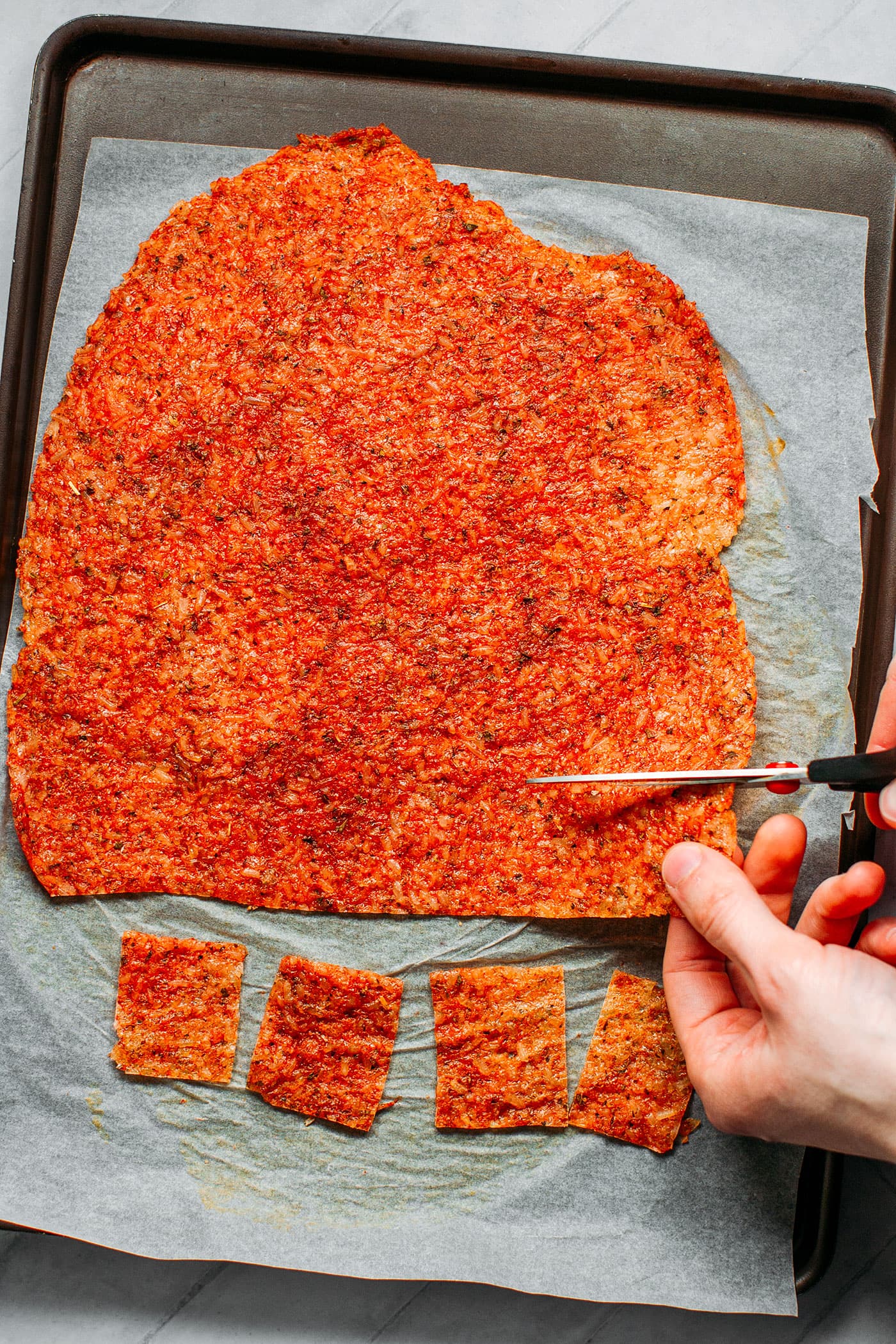 Cutting dried sticky rice into squares.