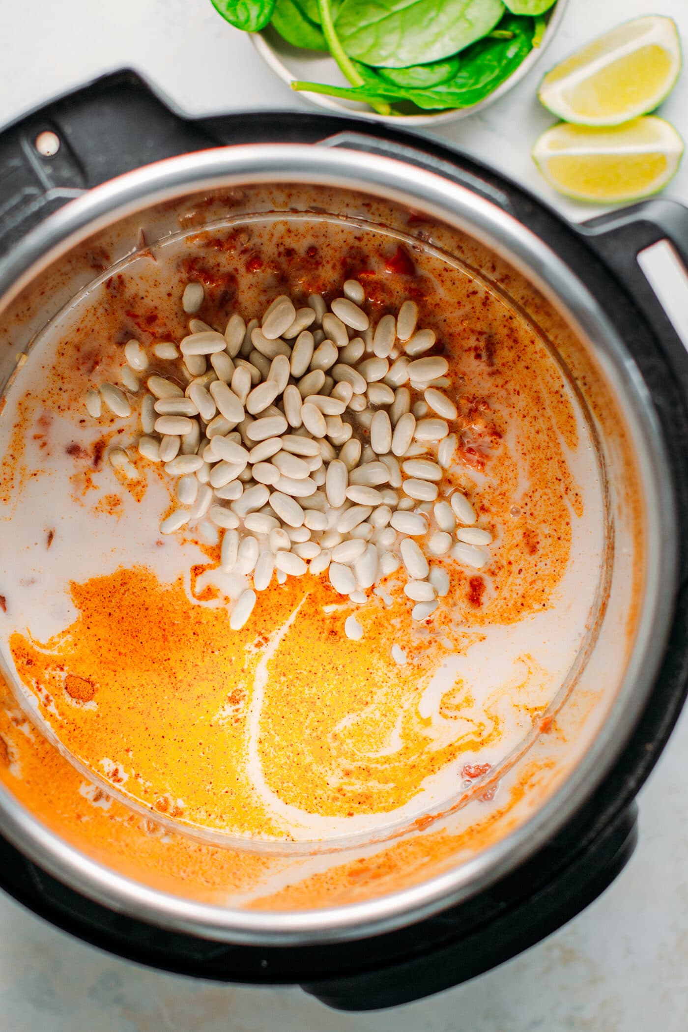 White beans with coconut milk and tomatoes in the Instant Pot.