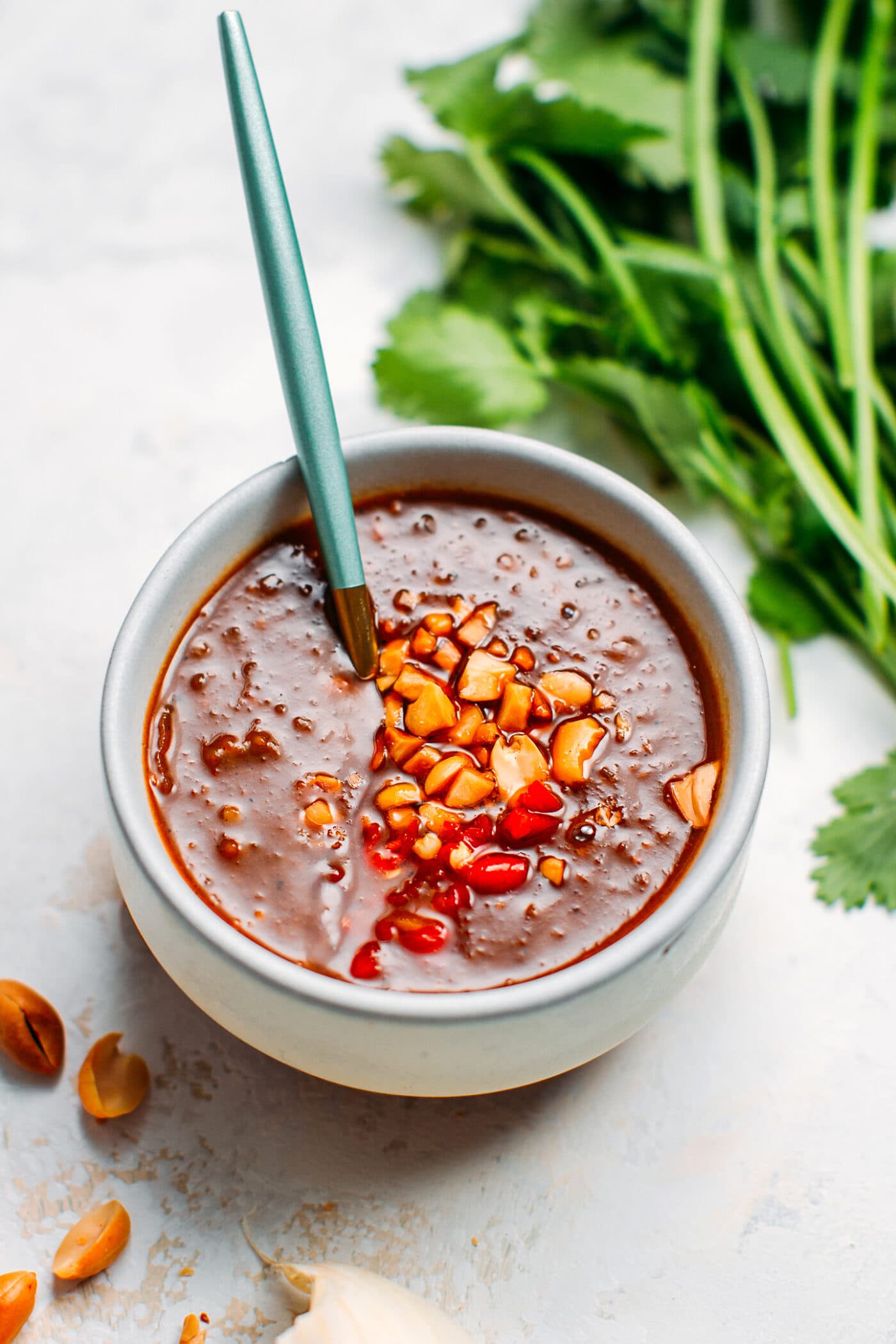 Vietnamese peanut dipping sauce with peanuts and chili.