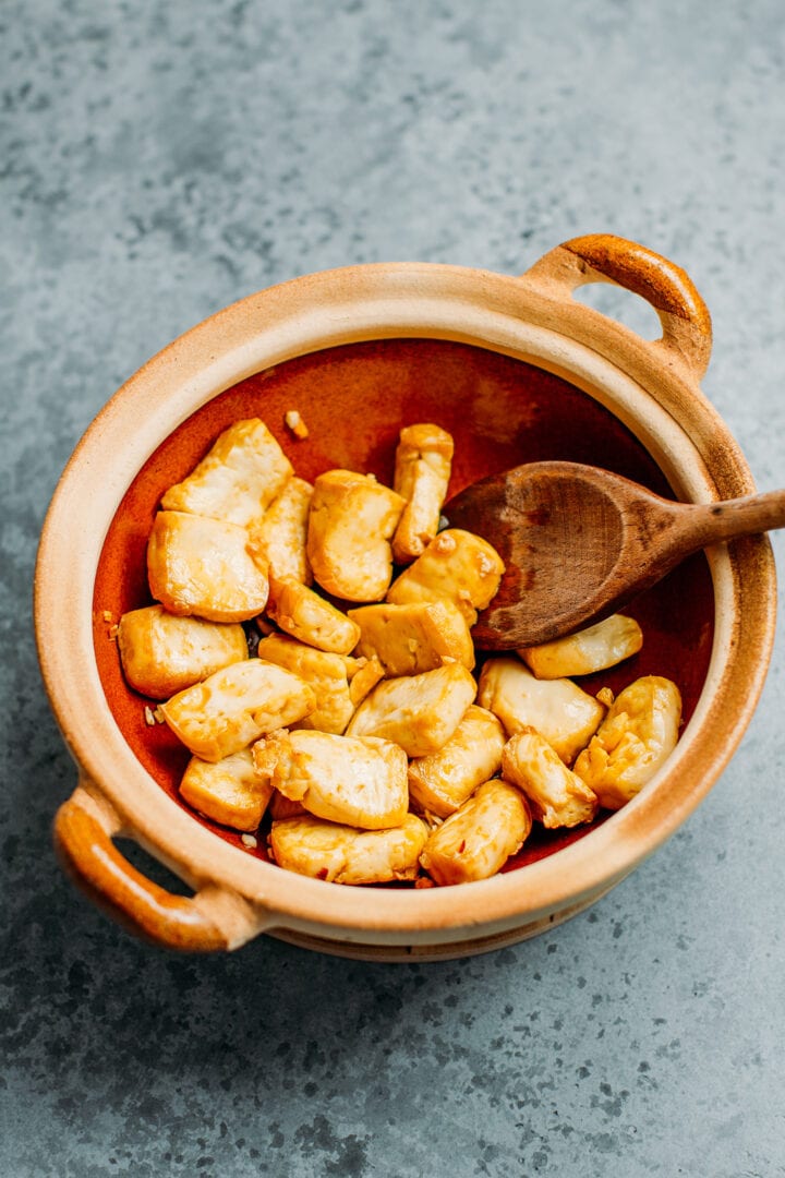 Fried tofu in a clay pot.