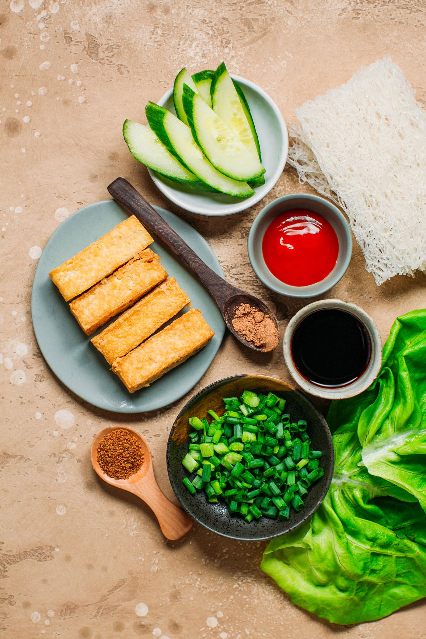 Ingredients like fried tofu, green onions, five spice, vermicelli woven.