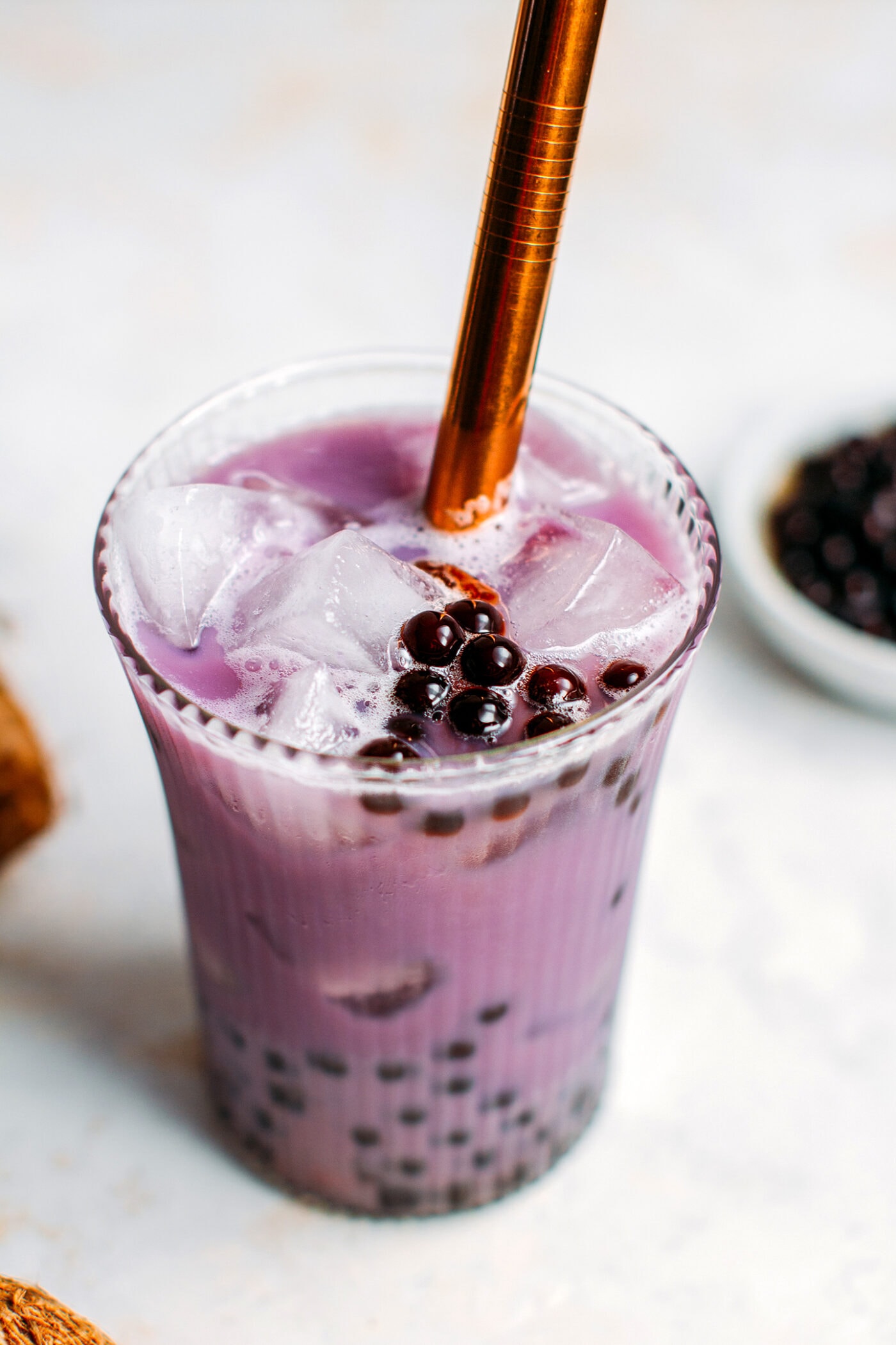 Close up of vegan taro milk tea with boba.