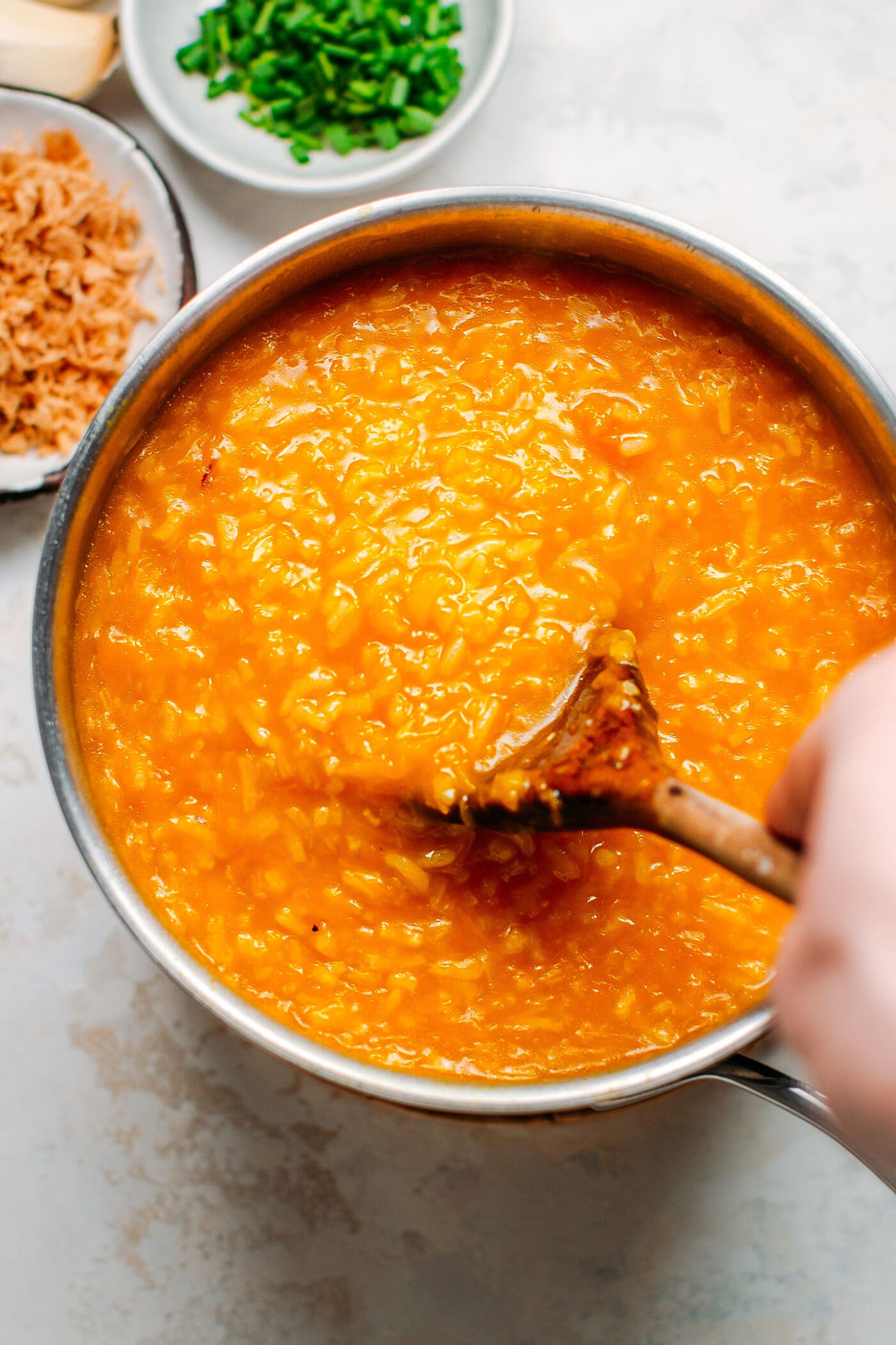 Pumpkin rice porridge in a saucepan.