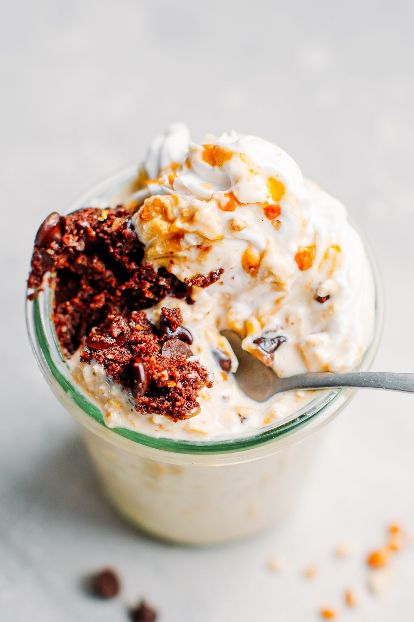 Close up of vanilla overnight oats with chocolate cookie dough and caramel.