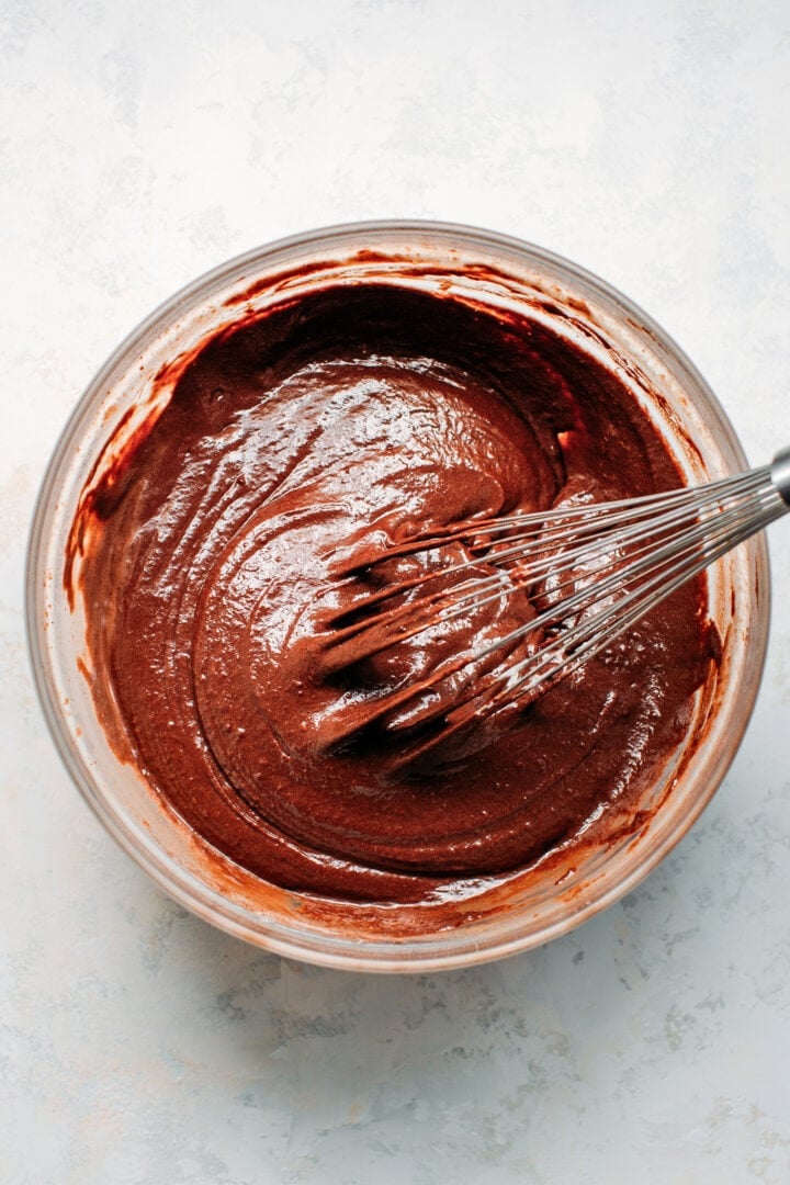 Batter for chocolate cake in a mixing bowl.