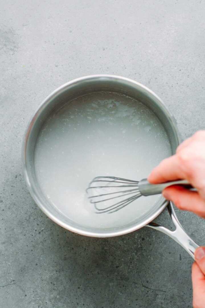 Whisking glutinous rice flour with water.