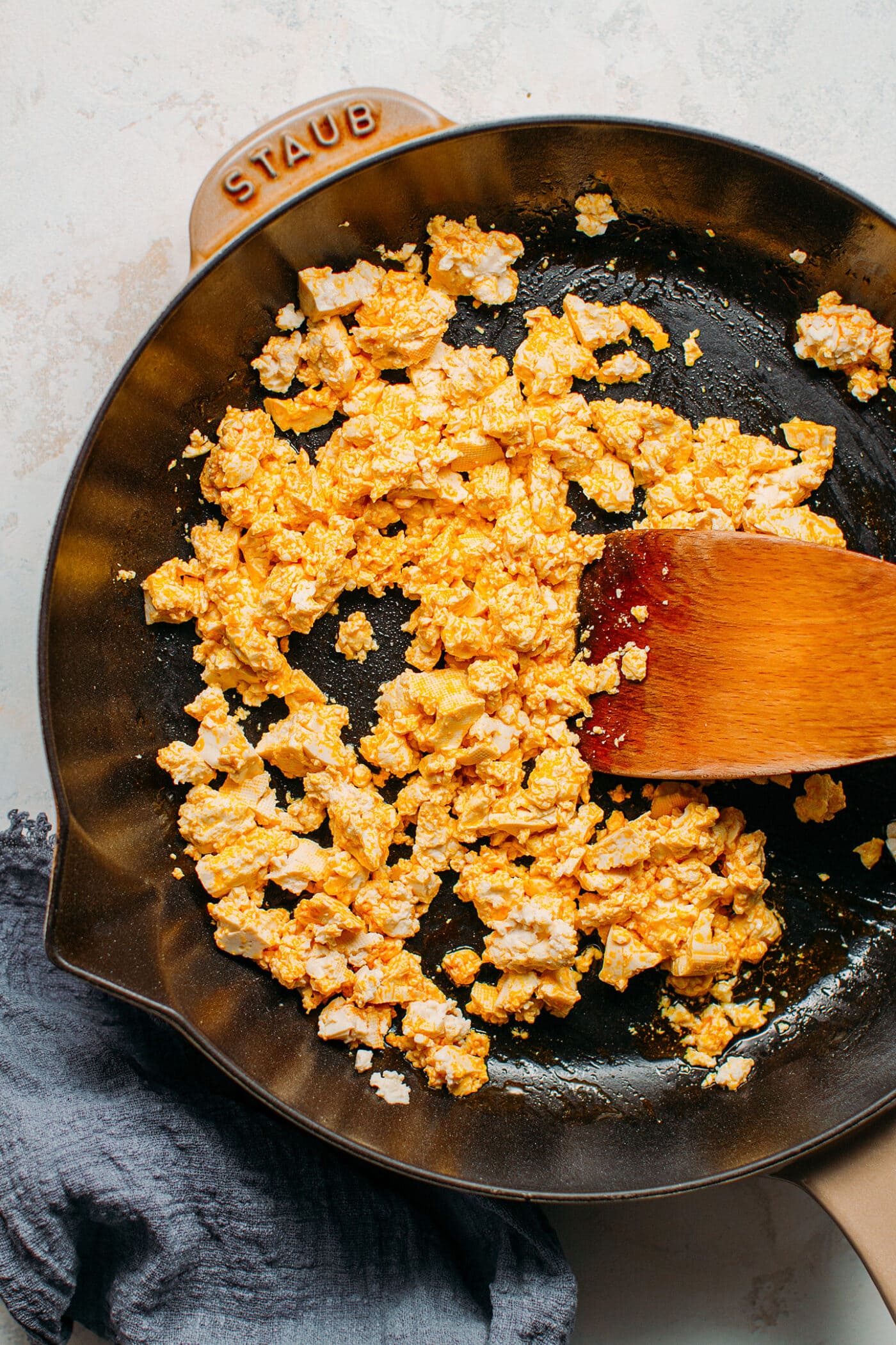 Sautéed tofu in a skillet.