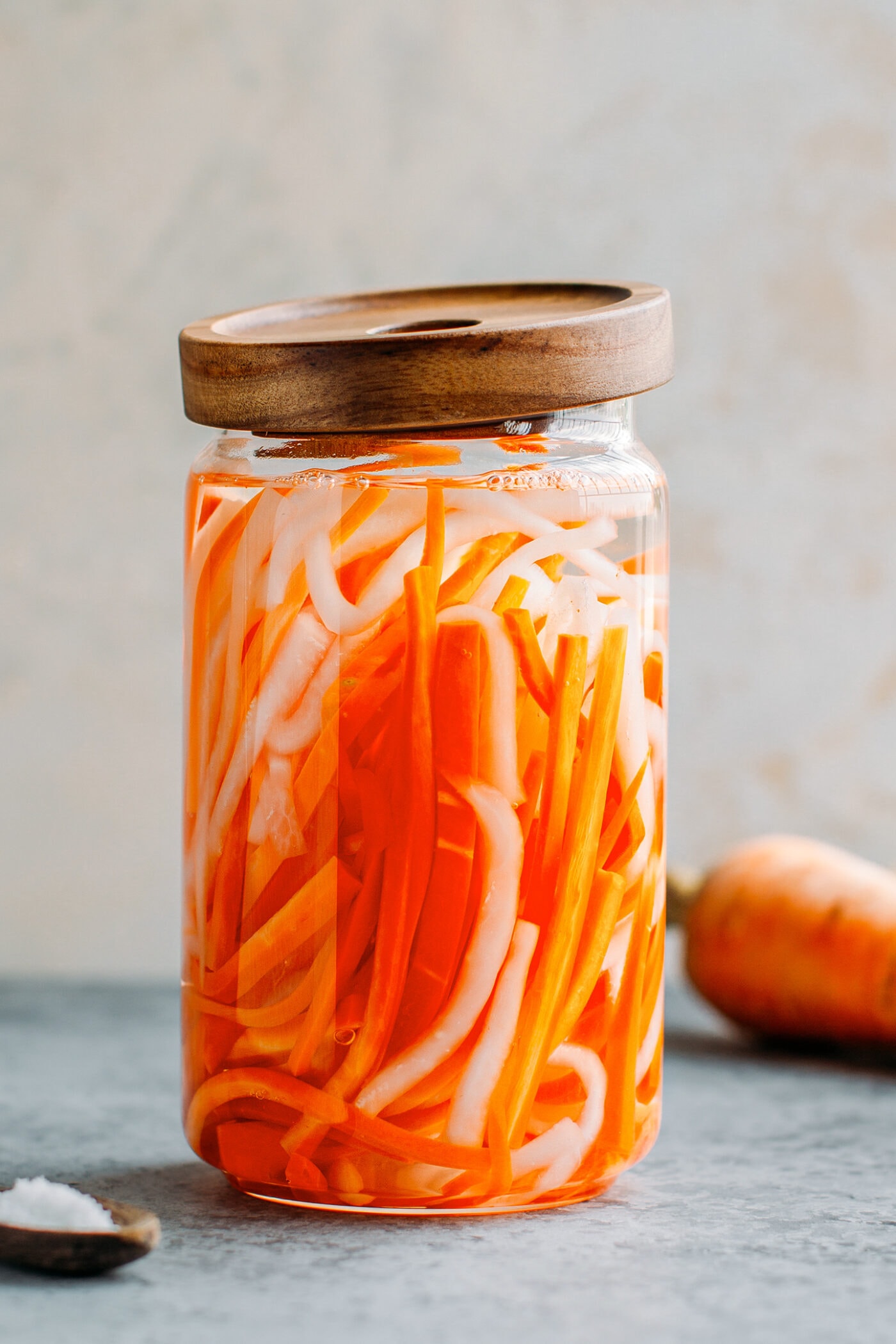 Carrot and daikon radish pickles in a jar.