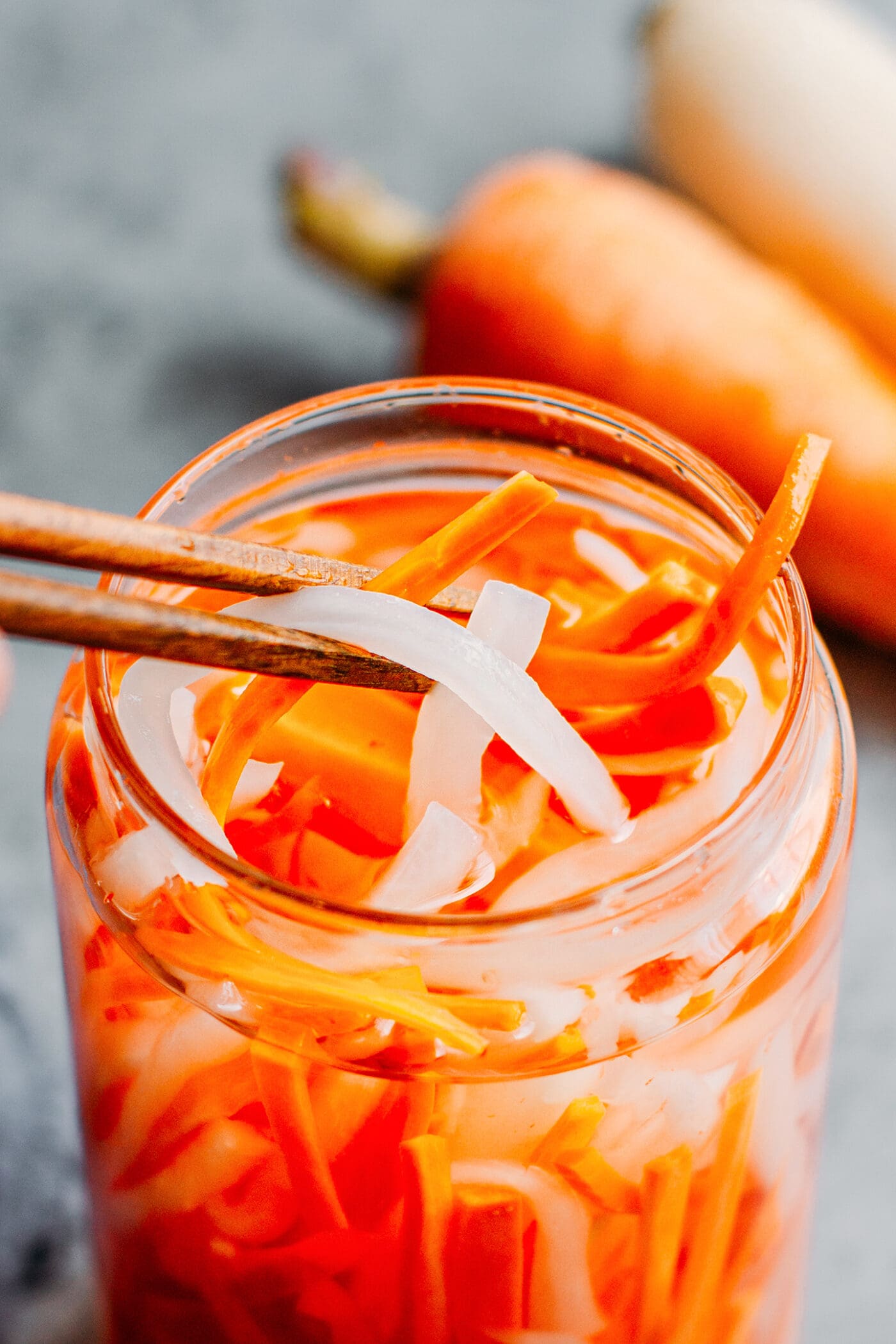 Close up of vietnamese pickles in a jar.