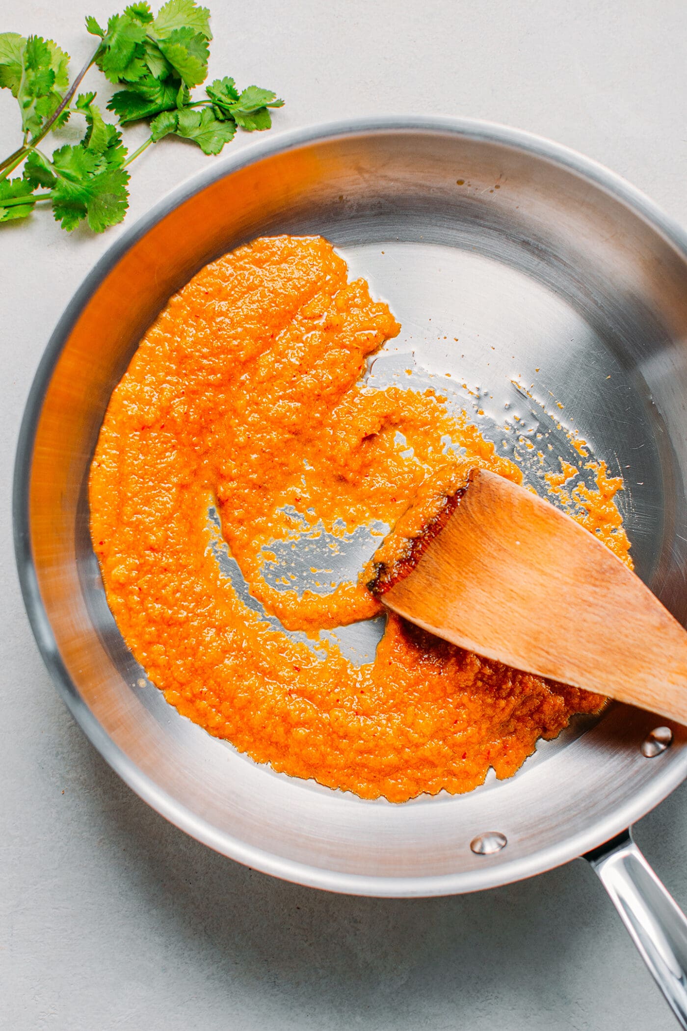 Frying homemade curry paste.