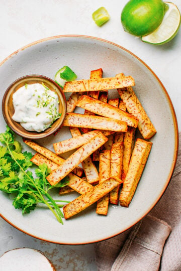 Taro fries in a plate with mayonnaise.