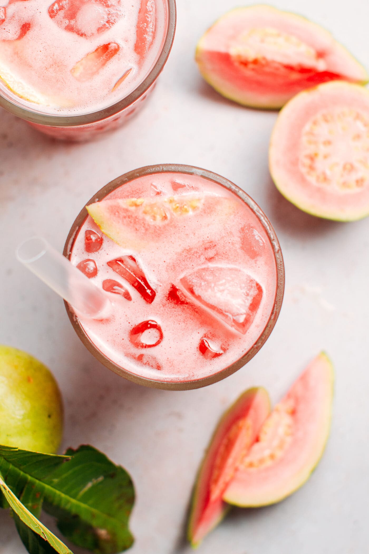 Glass of guava iced tea from top.