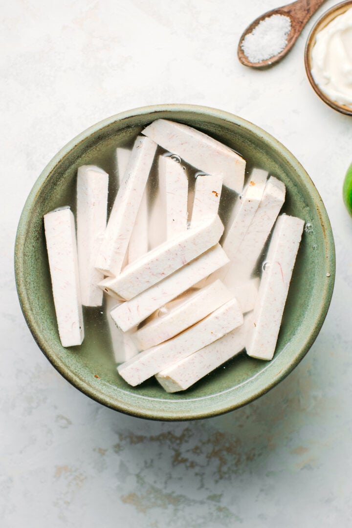 Taro strips soaking in water.