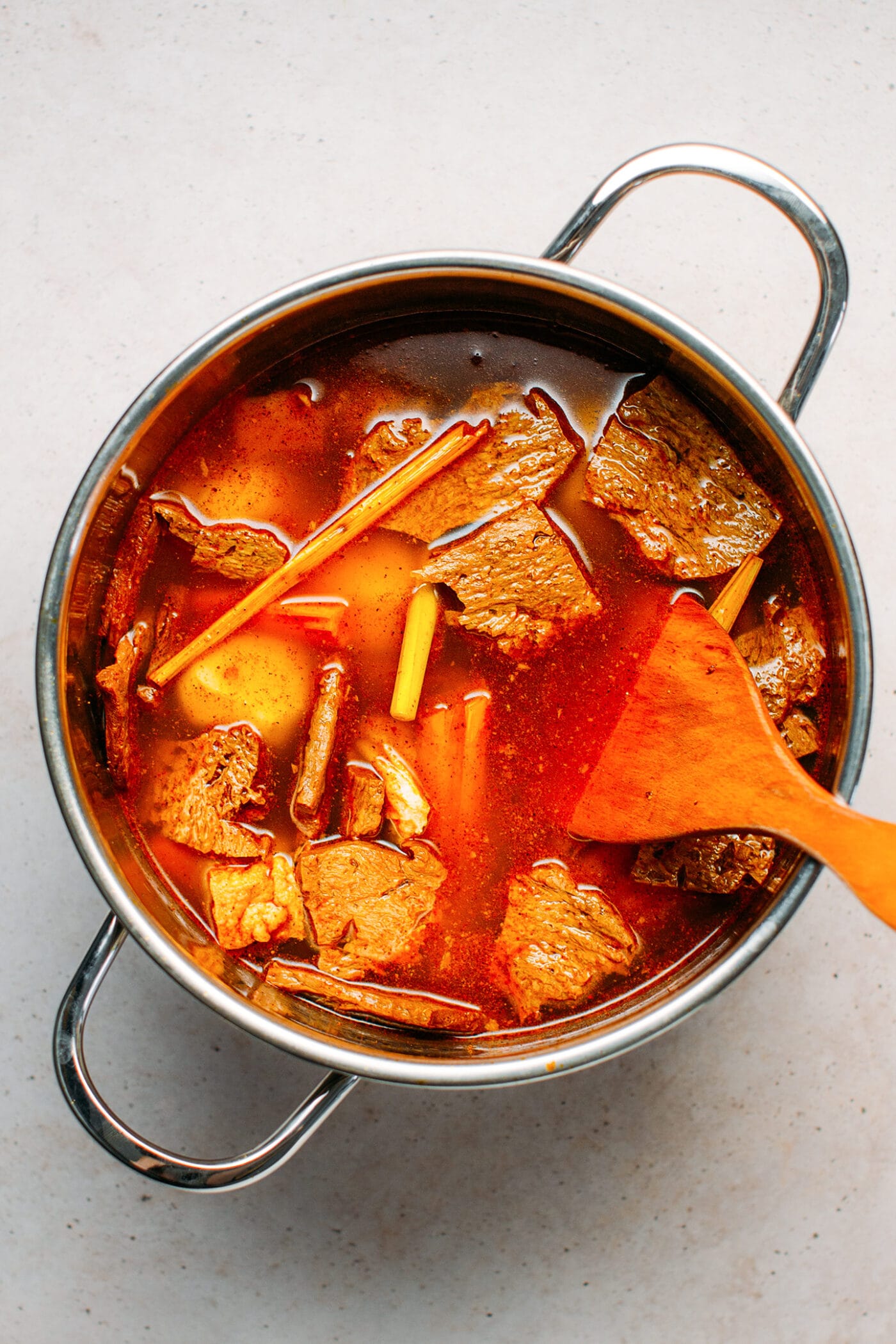 Vegan beef stew with lemongrass in a pot.