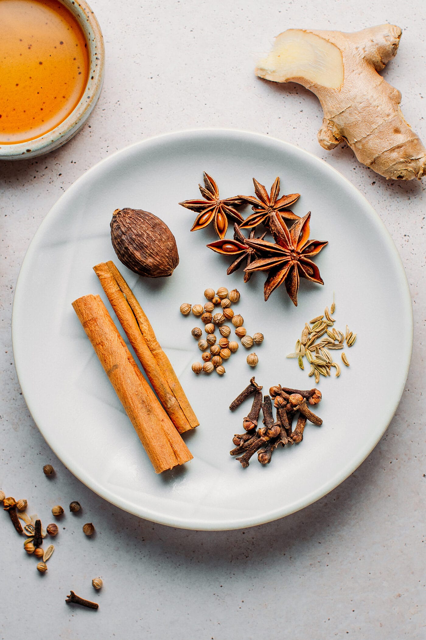 Spices to make pho, black cardamom, cinnamon, star anise, cloves, fennel seeds, and coriander seeds.