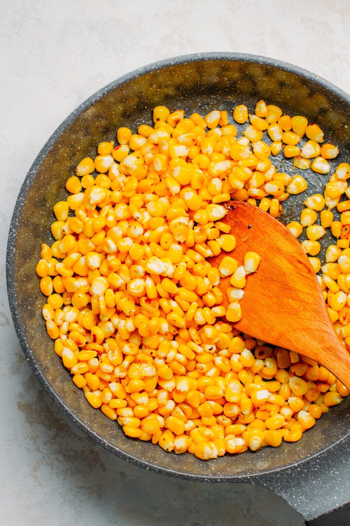 Sautéed corn in a skillet.