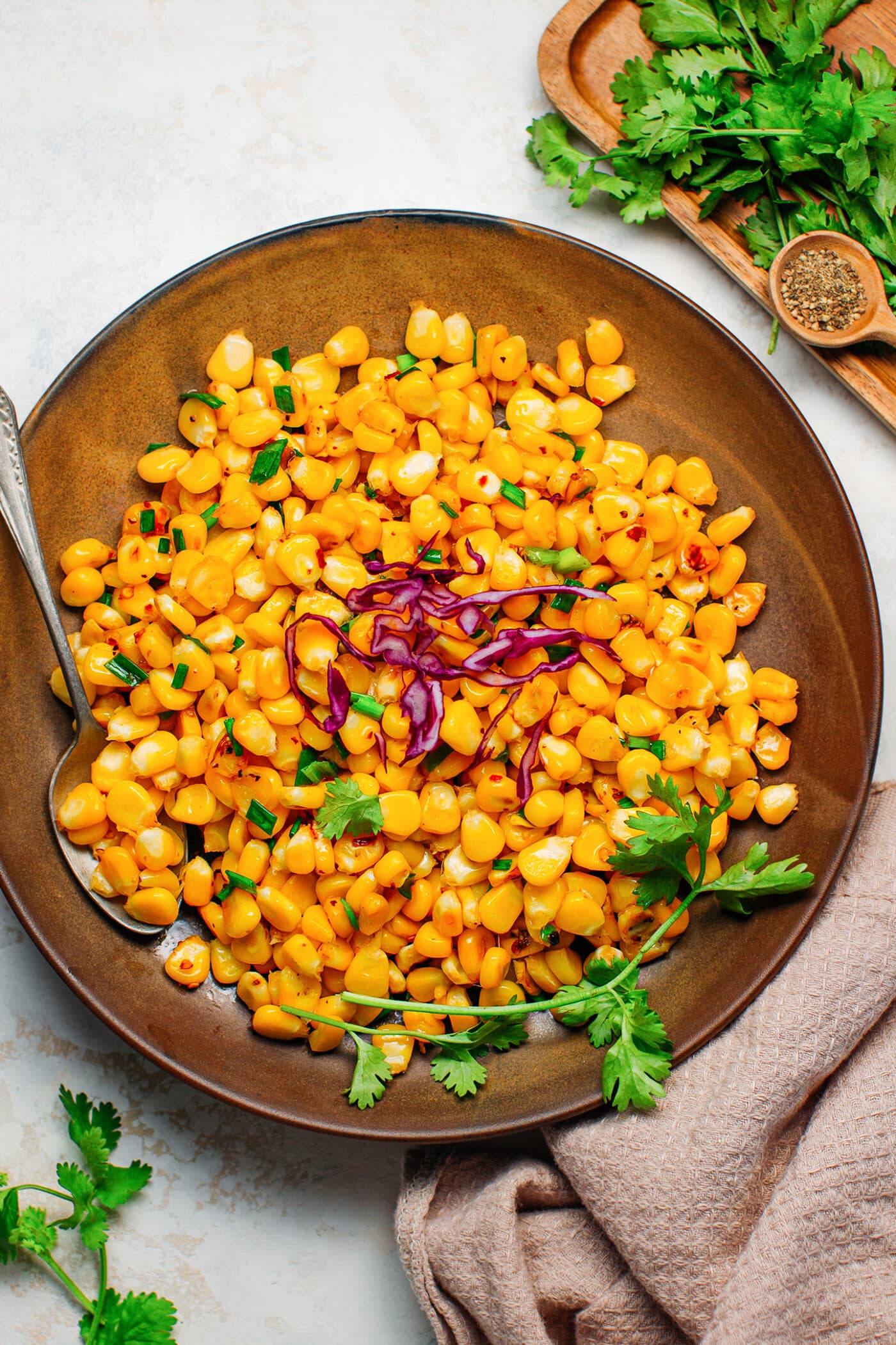 Sautéed butter corn with scallions and red cabbage.