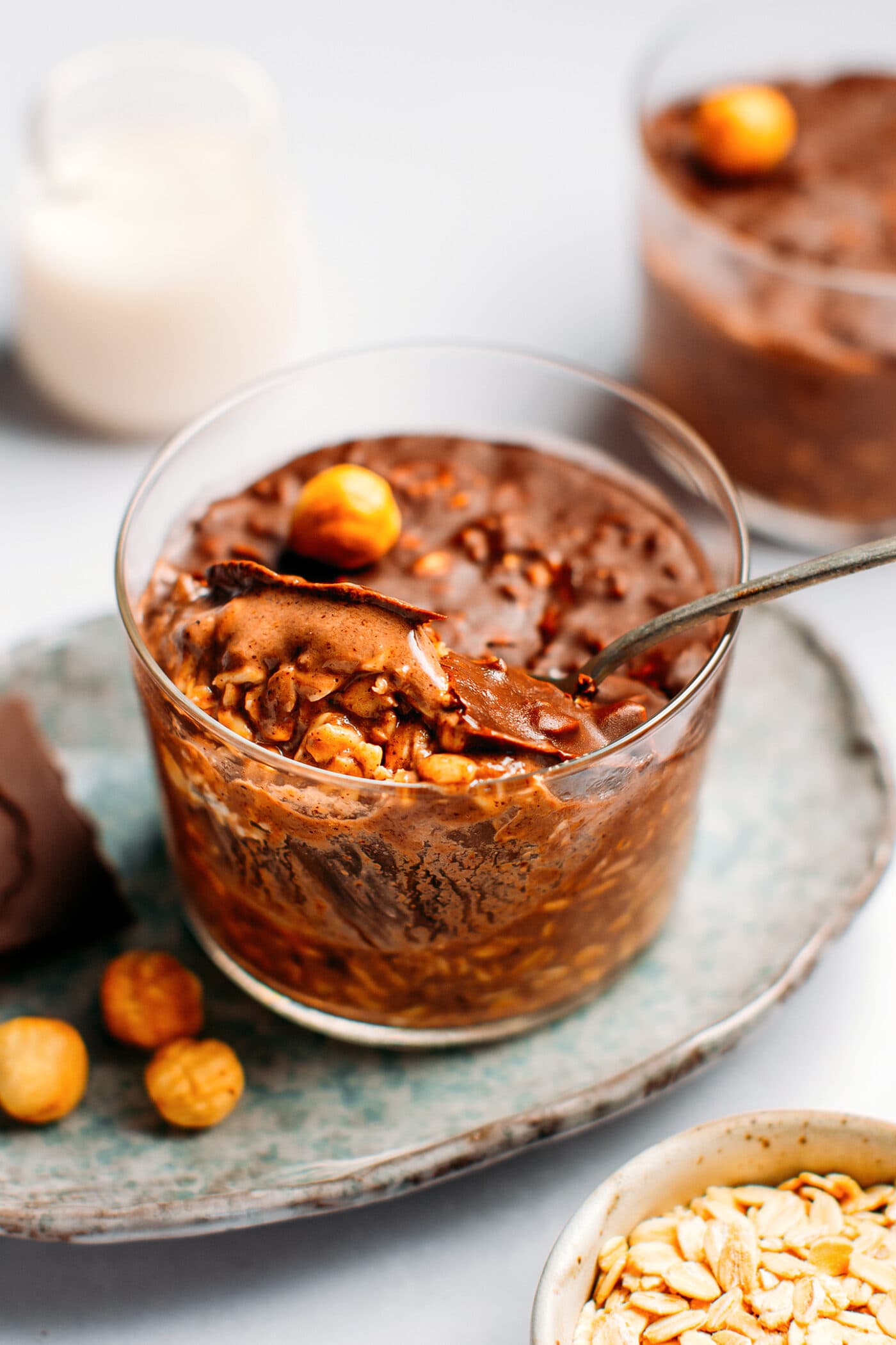 Chocolate overnight oats topped with a crispy chocolate shell.