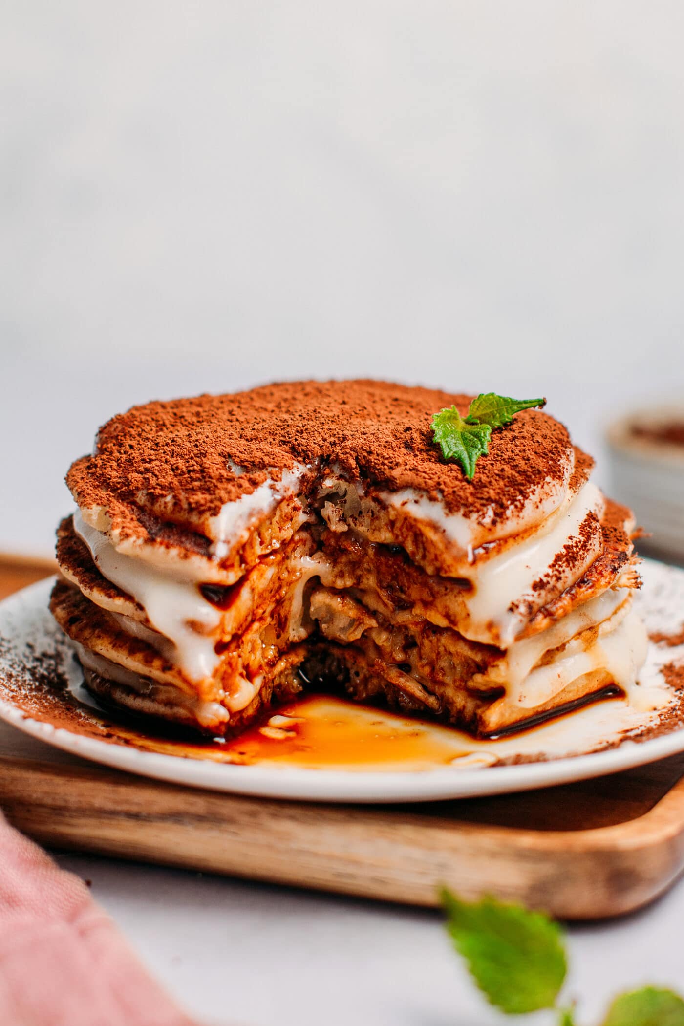 Close up of vegan tiramisu pancakes topped with cacao powder.