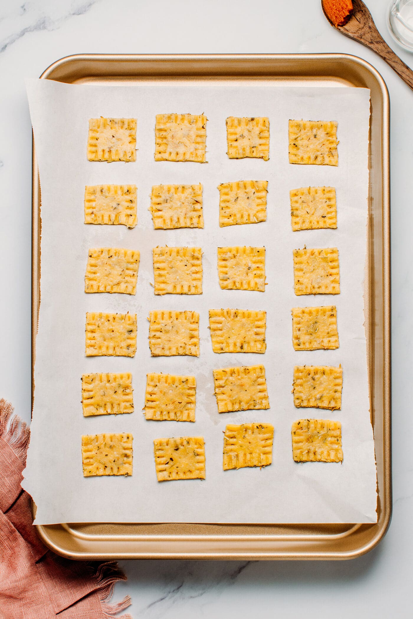 Vegan herb crackers on a baking sheet.